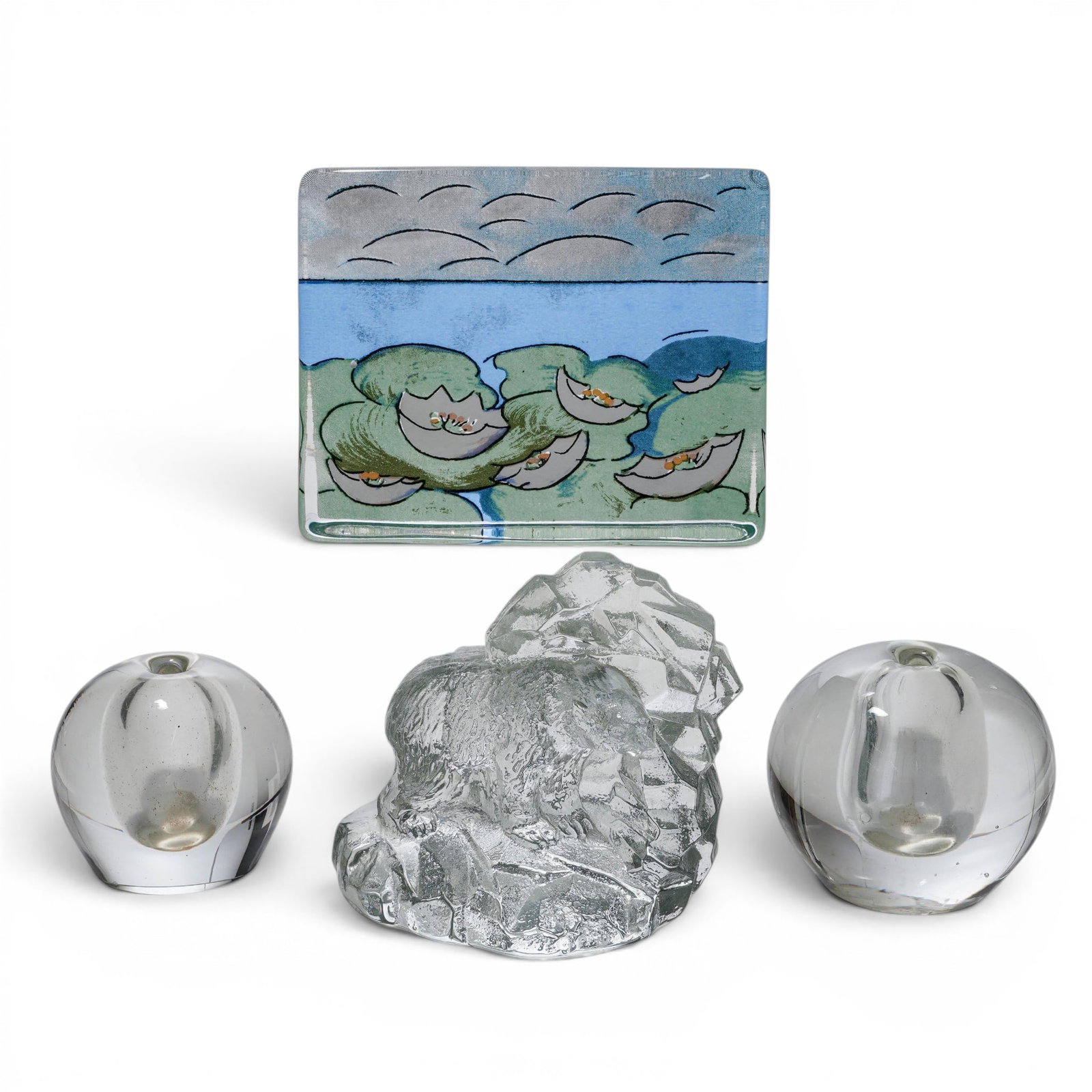 (4pc) Crystal Paperweight Group: (4pc) Crystal Paperweight Group 20th Cent., England The group includes: (1) Water Lily Glass Plaque. H: 4 5/8" W: 5 3/4" D: 1 1/4". Bear sticker "Made in England" (2)Spherical Crystal paperweights. H: