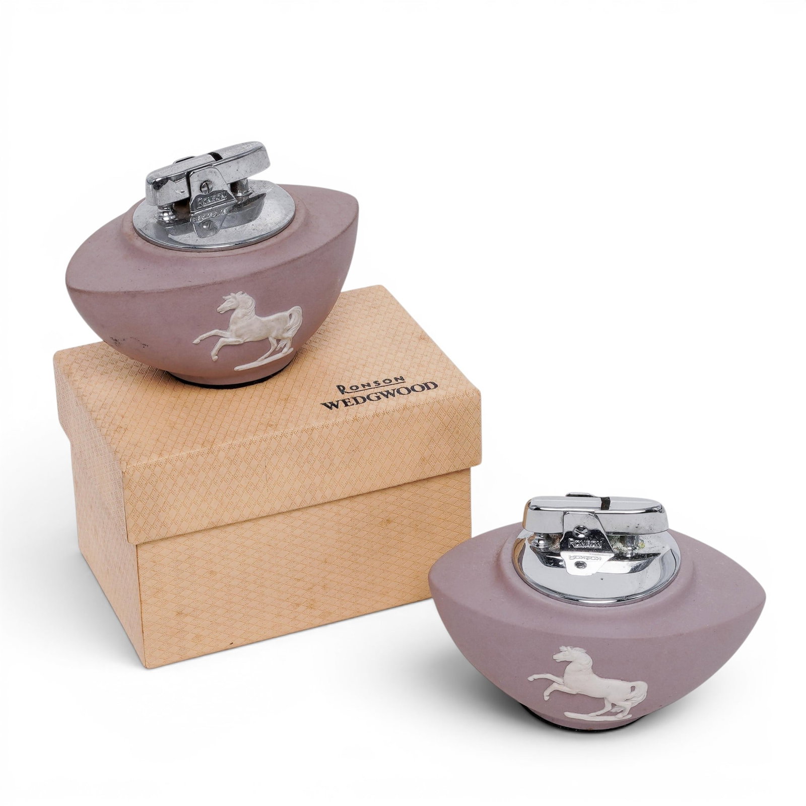 Pair of Ronson x Wedgwood Lilac Jasperware Lighters: Pair of Ronson x Wedgwood Lilac Jasperware Lighters 20th century, English A pair of Ronson x Wedgwood lilac jasperware lighters with horses in white relief. Lighters marked "Wedgwood made in England