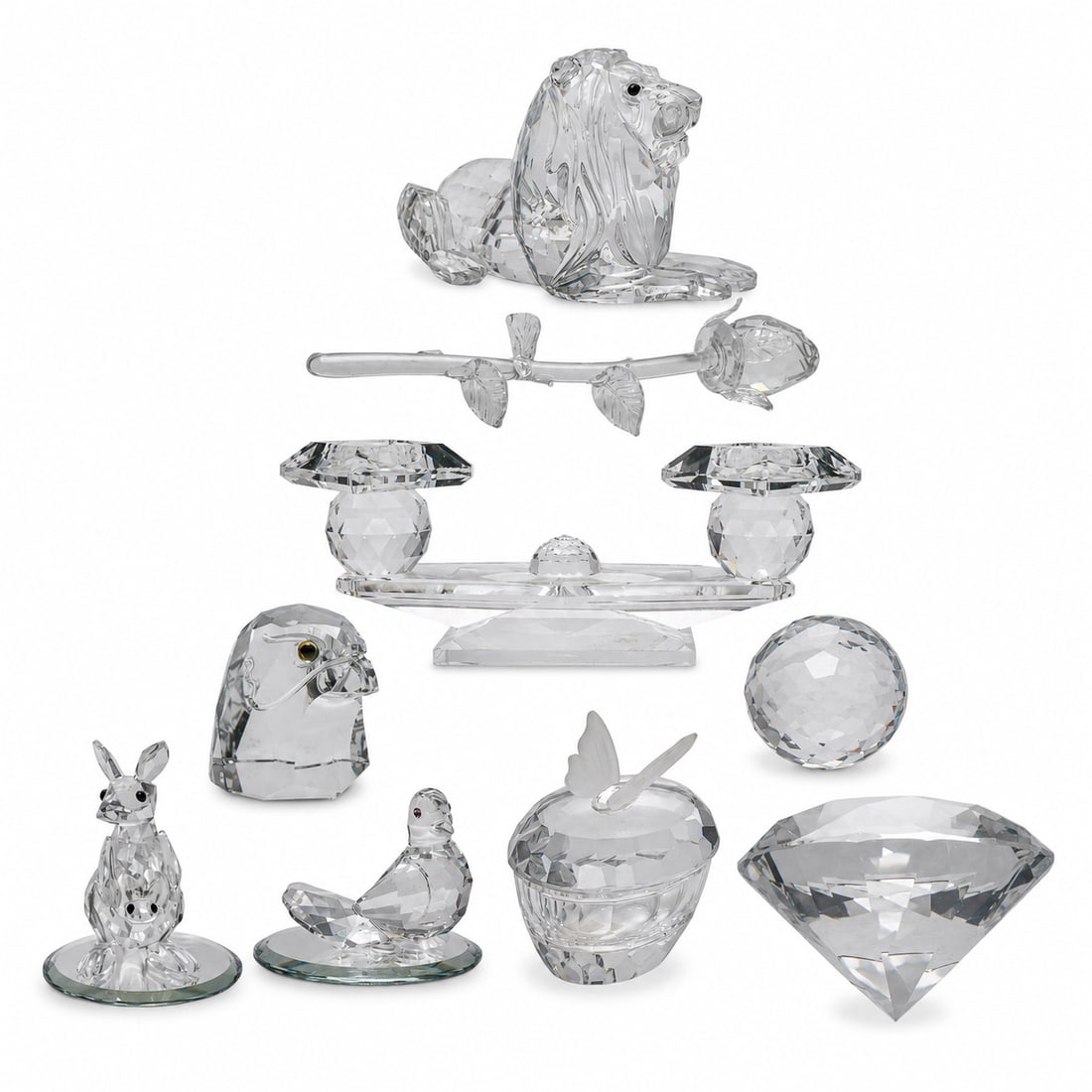 (9pc) Swarovski Lead Crystal Figurines Collection: (9pc) Swarovski Lead Crystal Figurines Collection 20th Cent., Austrian The collection includes: (1) Lion, "Inspiration Africa" trilogy. Marked "Swarovski" on the underside. H: 2 1/2 W: 3" D: 5" (1)Dou