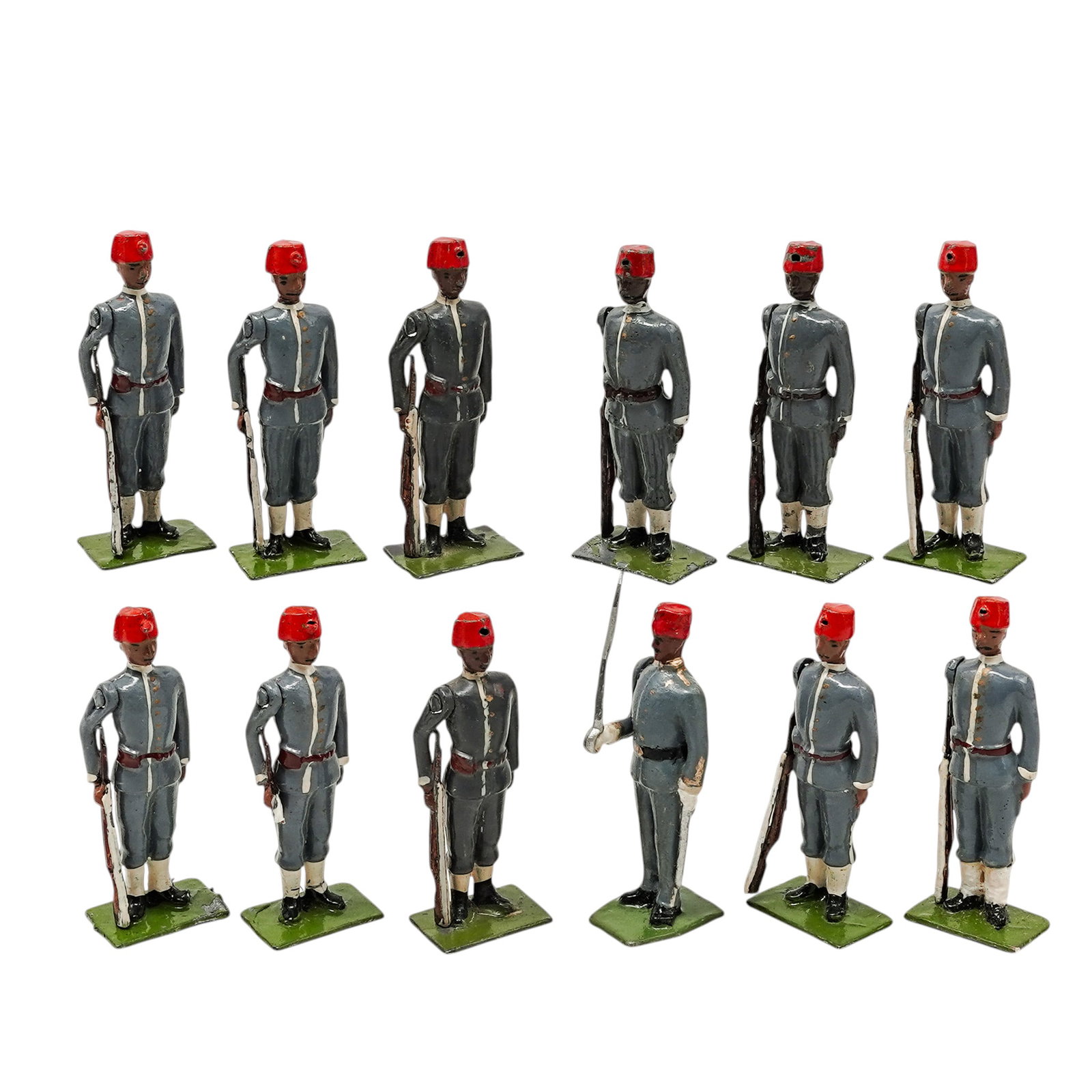 W. Britain "Egyptian Infantry" Toy Soldier Figurines: W. Britain "Egyptian Infantry" Toy Soldier Figurines c. 1925-1935, England This is a vintage W. Britain "Egyptian Infantry" # 117 toy soldier set. The set includes twelve figures with movable arms, fe
