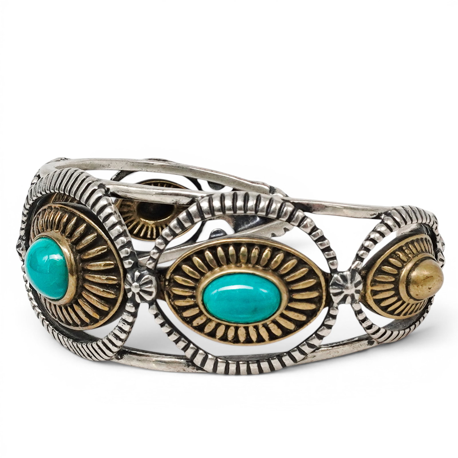 A Rosetta Romijo For Relios Silver, Brass, And Turquoise Cuff Bracelet: A Rosetta Romijo For Relios Silver, Brass, And Turquoise Cuff Bracelet Late 20th century Stamped: Rosetta Romijo hallmark / Relios hallmark / .925 / Brass. A cuff bracelet with three bezel set turquoi