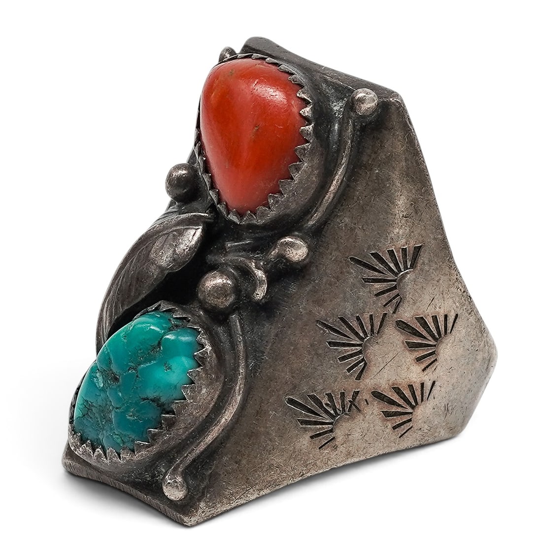 A Navajo Sterling Silver, Turquoise, And Coral Stampwork Ring: A Navajo Sterling Silver, Turquoise, And Coral Stampwork Ring Late 20th century Unmarked. Tested sterling silver. A wide tapered ring with bezel-set turquoise and coral cabochons, accented by twisted 