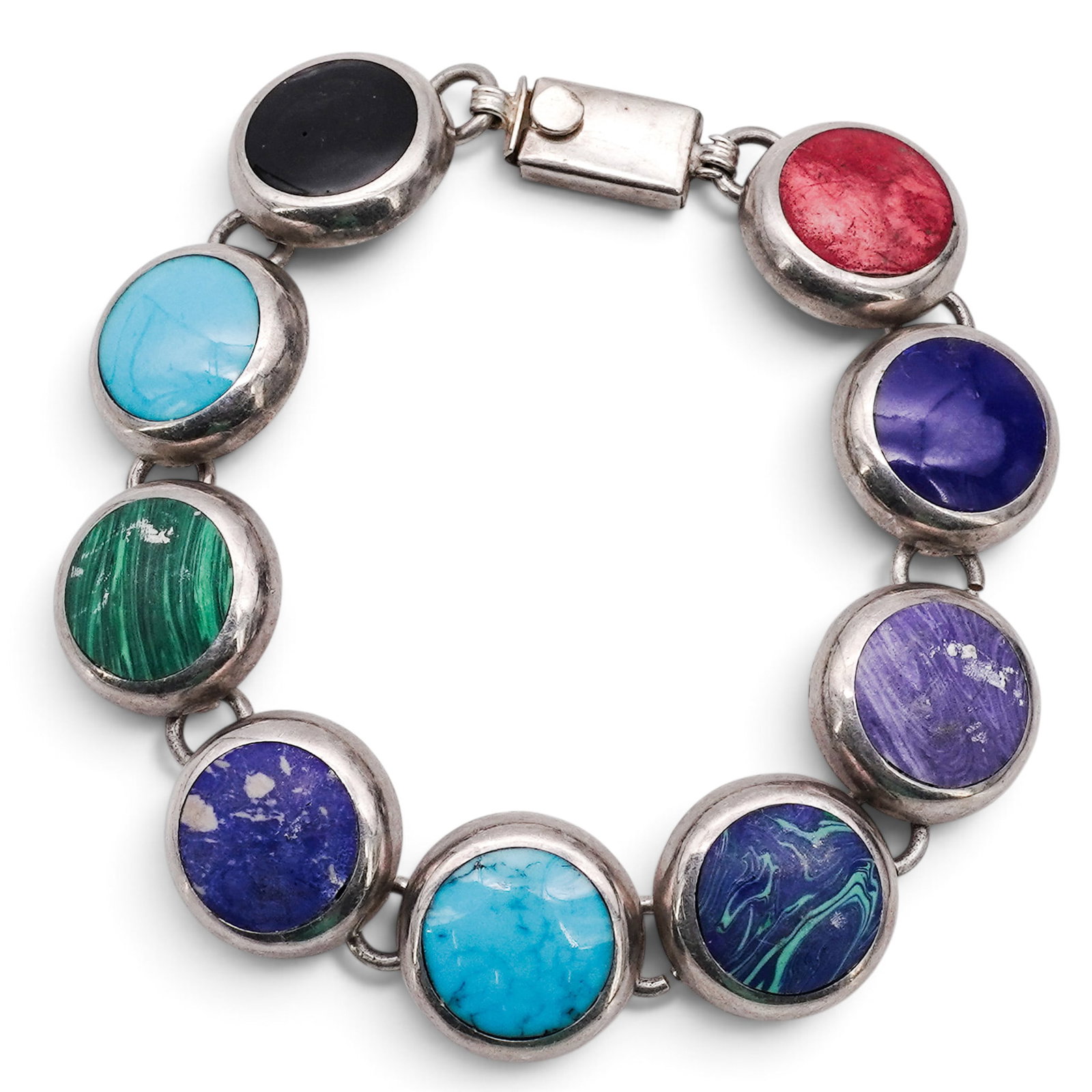A Mexican Sterling Silver Multistone Link Bracelet: A Mexican Sterling Silver Multistone Link Bracelet Late 20th Century Stamped: Mexico / 925. An articulated bracelet composed of circular bezel-set cabochons of assorted stones, including onyx, turquoi