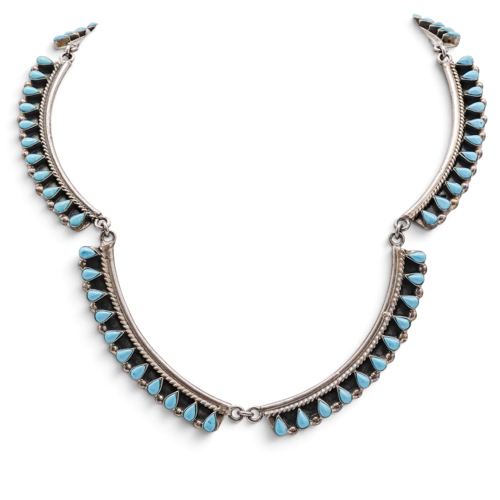 A Mexican Sterling Silver And Turquoise Cluster Panel Bracelet: A Mexican Sterling Silver And Turquoise Cluster Panel Bracelet Late 20th century Stamped: B / Mexico / TV-115 / 925. A bracelet composed of three articulated curved silver panels, each bordered by row