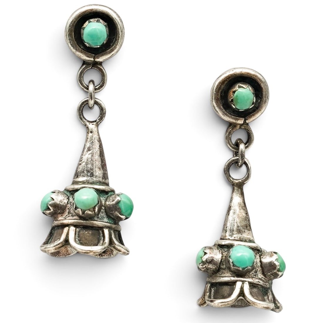 A Pair Of Navajo Sterling Silver And Green Stone Floral Dangle Post Earrings: A Pair Of Navajo Sterling Silver And Green Stone Floral Dangle Post Earrings Late 20th century Unmarked. Tested sterling silver. Each with green stone cabochons in floral and butterfly motifs suspendi