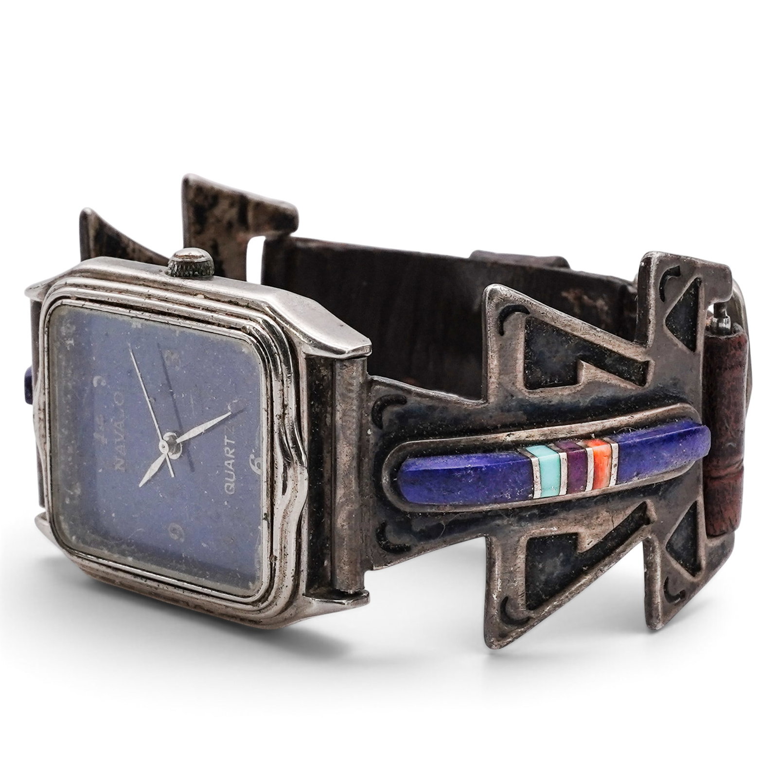 A J. Velasquez Navajo Sterling Silver, Lapis Lazuli Inlay, And Leather Wristwatch: A J. Velasquez Navajo Sterling Silver, Lapis Lazuli Inlay, And Leather Wristwatch Late 20th century Stamped: Silver Bands: J. Velasquez / Watch Face: Navajo, Quartz / Watch Back: Hong Kong Dial, Japan