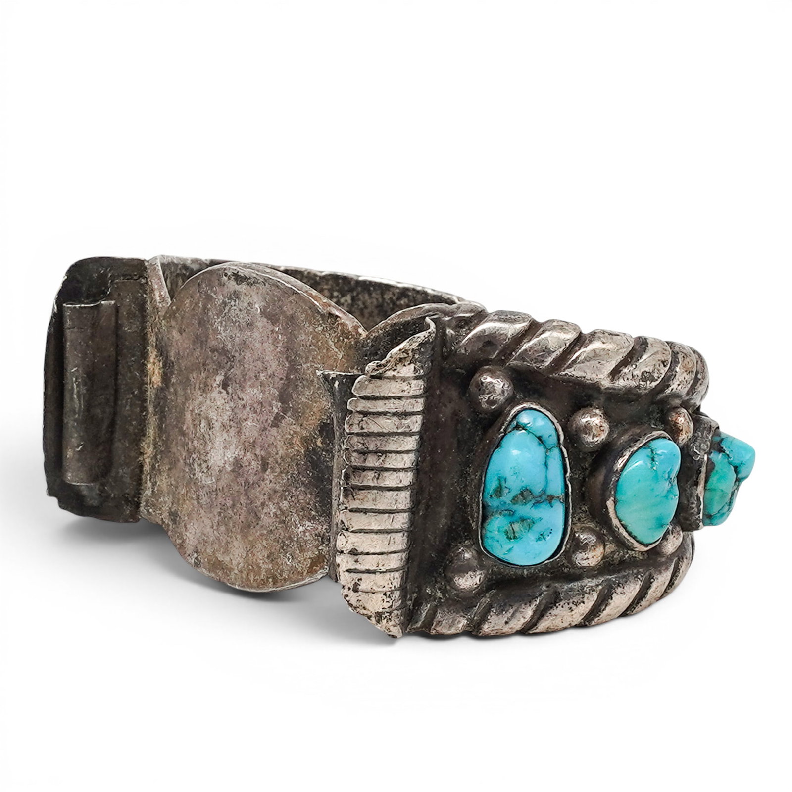 A Wilson Tsosie Navajo Sterling Silver, Turquoise, Coral, And Watch Cuff Bracelet: A Wilson Tsosie Navajo Sterling Silver, Turquoise, Coral, And Watch Cuff Bracelet Late 20th century Stamped: W.T. / an unidentified bird mark. Tested sterling silver. A heavy sterling silver watch cuf