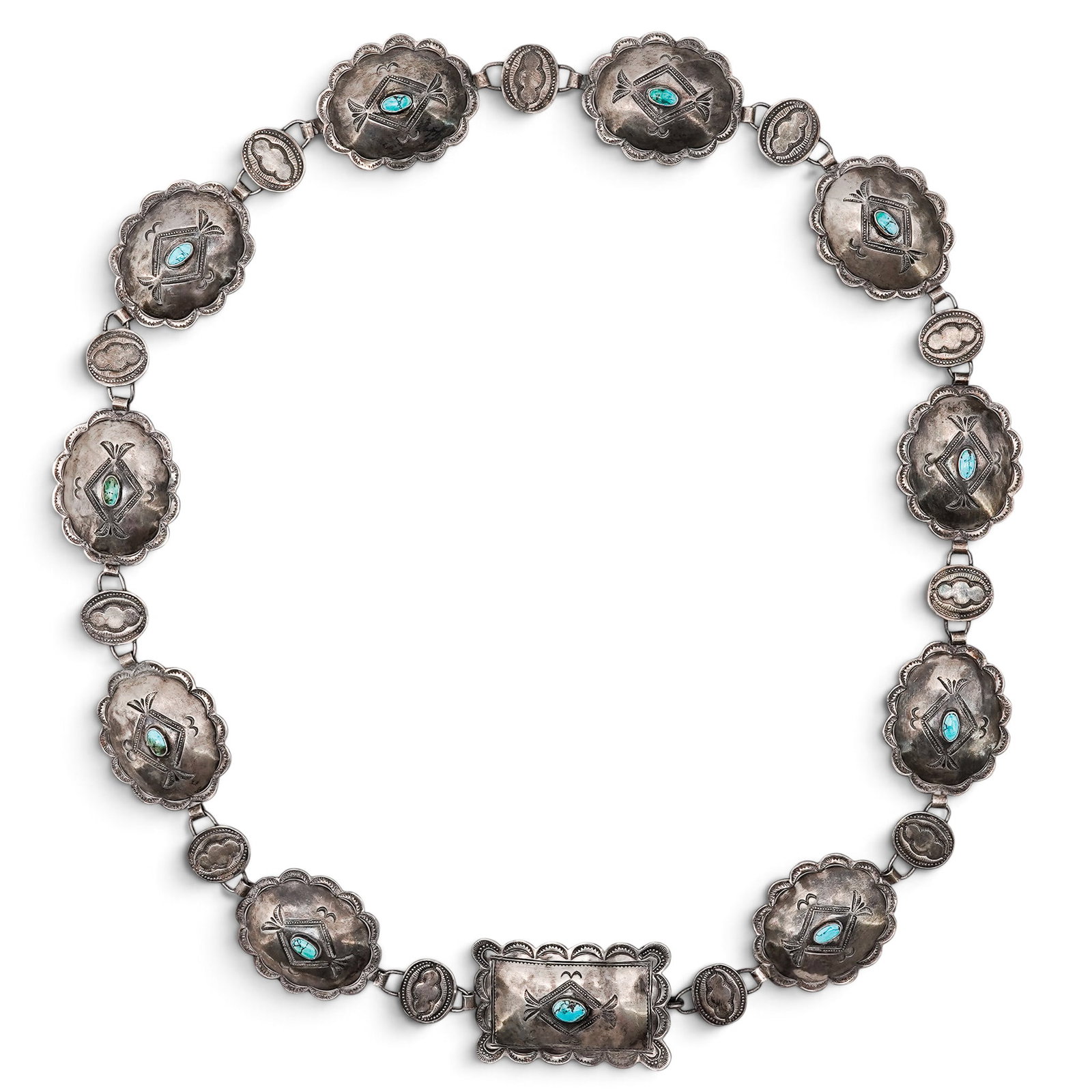 A Navajo Sterling Silver And Turquoise Concho Belt: A Navajo Sterling Silver And Turquoise Concho Belt Late 20th century Unmarked. Tested sterling silver. A concho belt composed of twelve oval and rectangular conchos, each centered by a turquoise caboc
