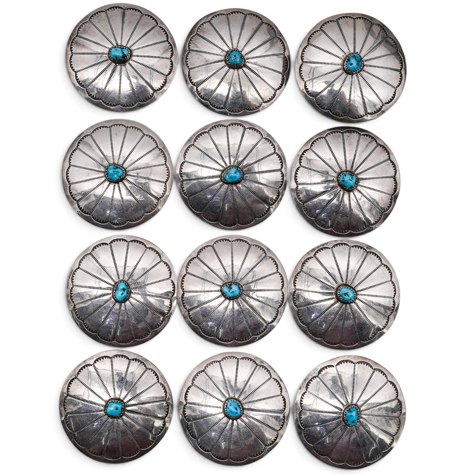 (12 Pc) A Navajo Sterling Silver And Turquoise Concho Belt Set: (12 Pc) A Navajo Sterling Silver And Turquoise Concho Belt Set Late 20th century Stamped: Sterling. Comprising of twelve circular conchos, each centered by a turquoise cabochon in a serrated bezel and