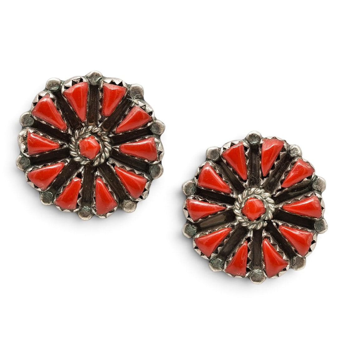A Pair Of Navajo Sterling Silver And Coral Cluster Post Earrings: A Pair Of Navajo Sterling Silver And Coral Cluster Post Earrings Late 20th century Stamped: Sterling Each with a cluster of coral cabochons arranged in a radial floral design with a central coral cabo