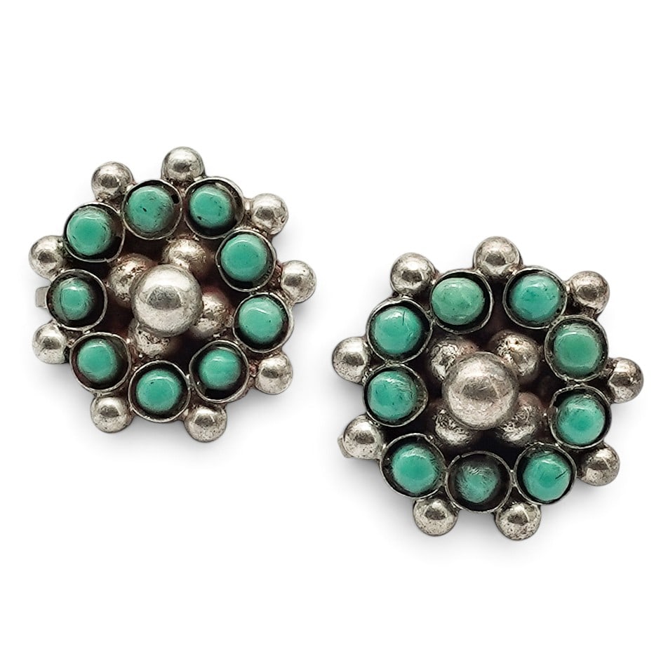 A Pair Of Mexican Sterling Silver And Turquoise Cluster Screwback Earrings: A Pair Of Mexican Sterling Silver And Turquoise Cluster Screwback Earrings Late 20th Century Marked: Hecho en Mexico / 925 / MBM / illegible hallmark. Each with a central domed silver bead surrounded 