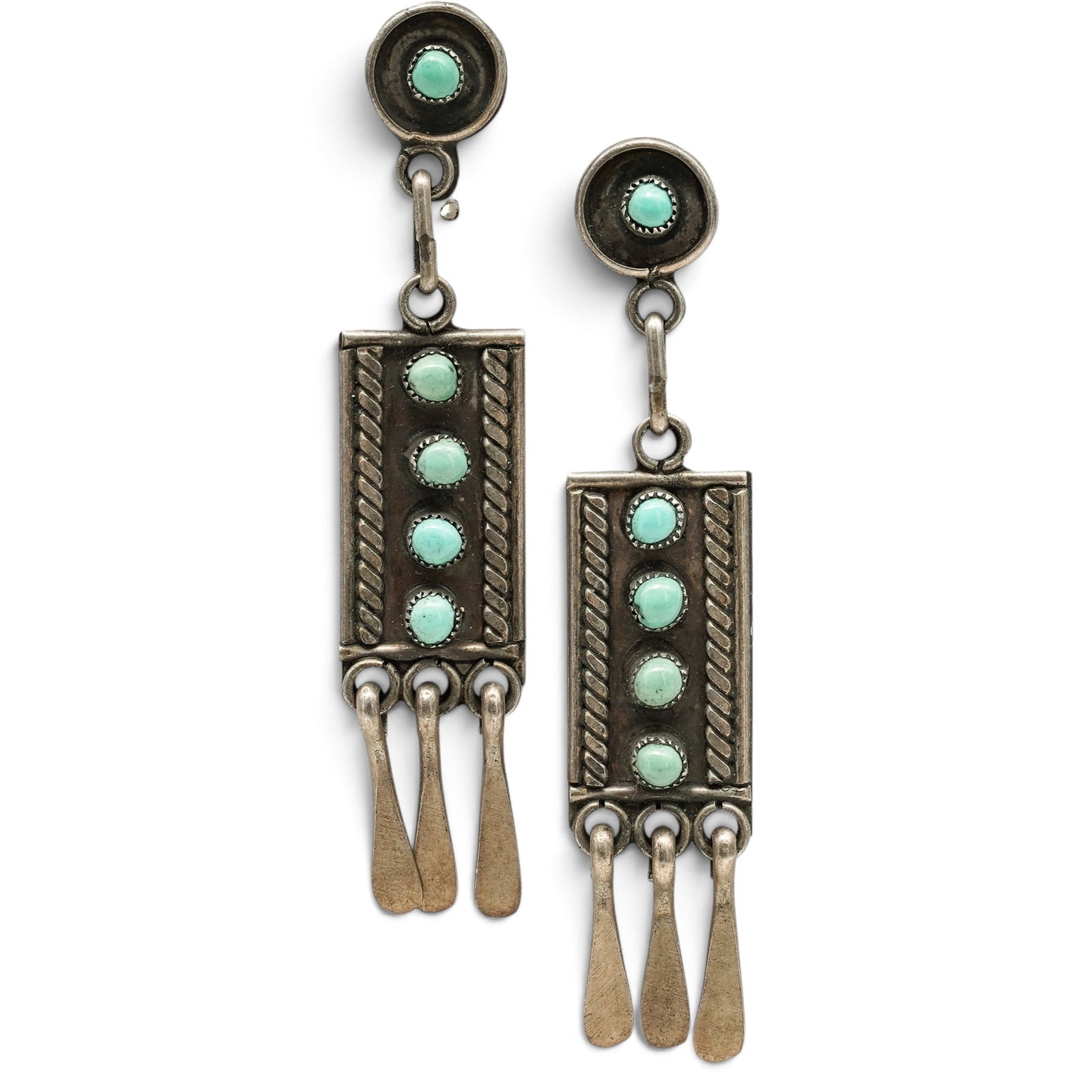 A Pair Of Navajo Sterling Silver And Turquoise Fringe Dangle Earrings: A pair of Navajo sterling silver and turquoise fringe dangle earrings Late 20th century Unmarked. Tested sterling silver. Each with a circular openwork drop suspended from a bezel-set turquoise caboch