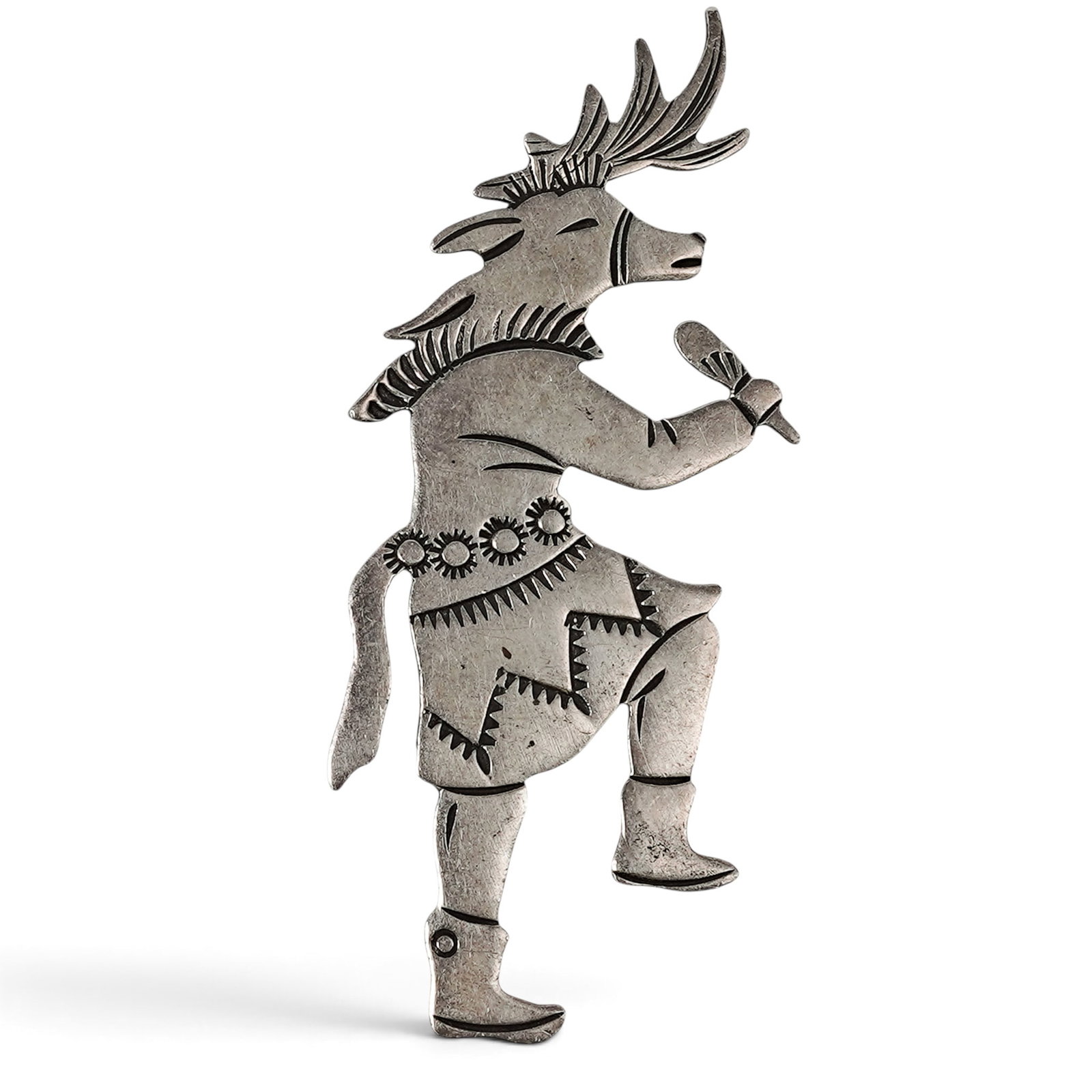 A Robert Becenti Jr Navajo Sterling Silver Figural Dancer Brooch: A Robert Becenti Jr Navajo sterling silver figural dancer brooch Late 20th century Stamped: B-C-T / Sterling. A cutout figural brooch depicting a ceremonial animal-form dancer with engraved costume de