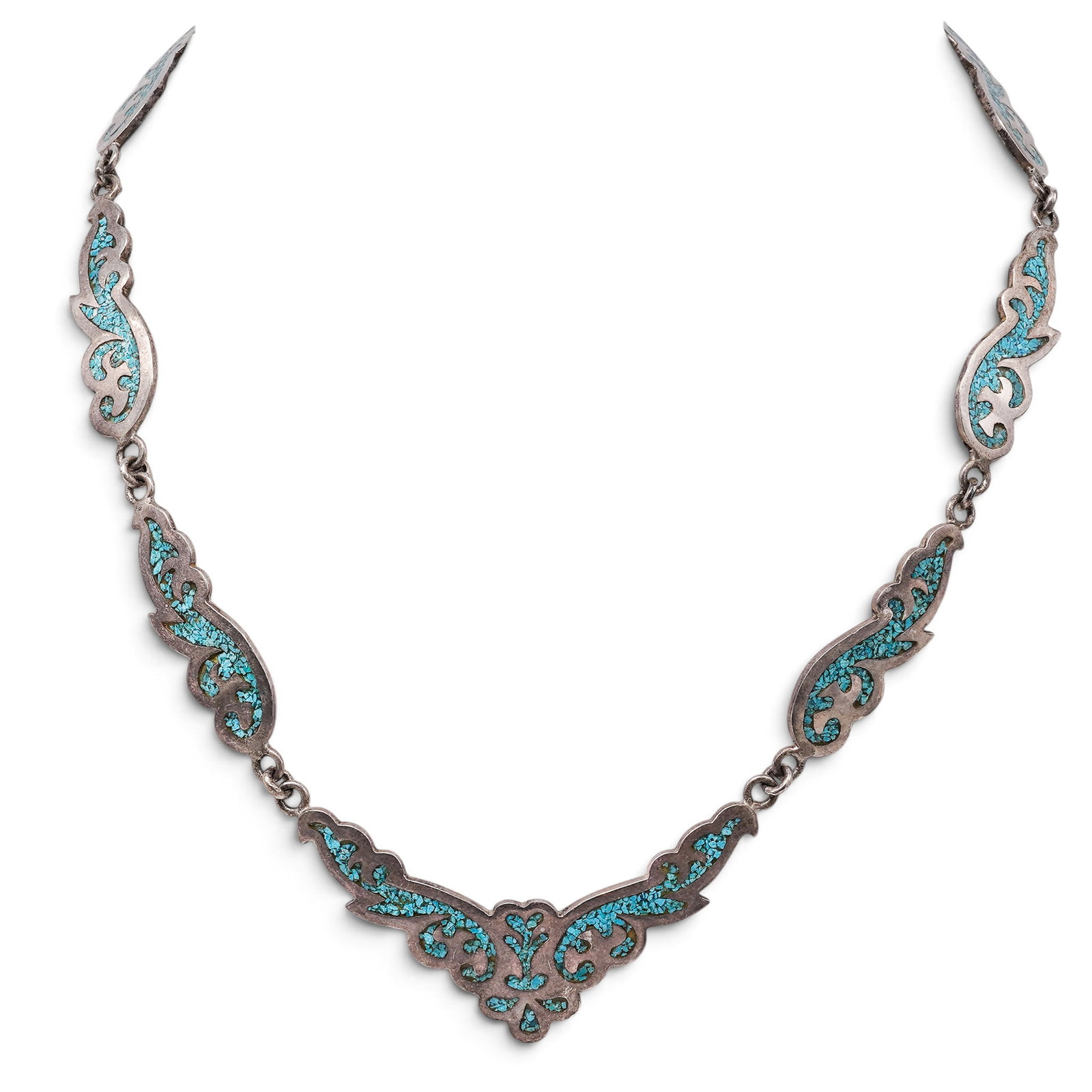 A Mexican Sterling Silver And Turquoise Chip Inlay Link Necklace: A Mexican sterling silver and turquoise chip inlay link necklace Late 20th century Stamped: TH-15 / 925. A necklace composed of scrolling and foliate-form links decorated with turquoise chip inlay, jo