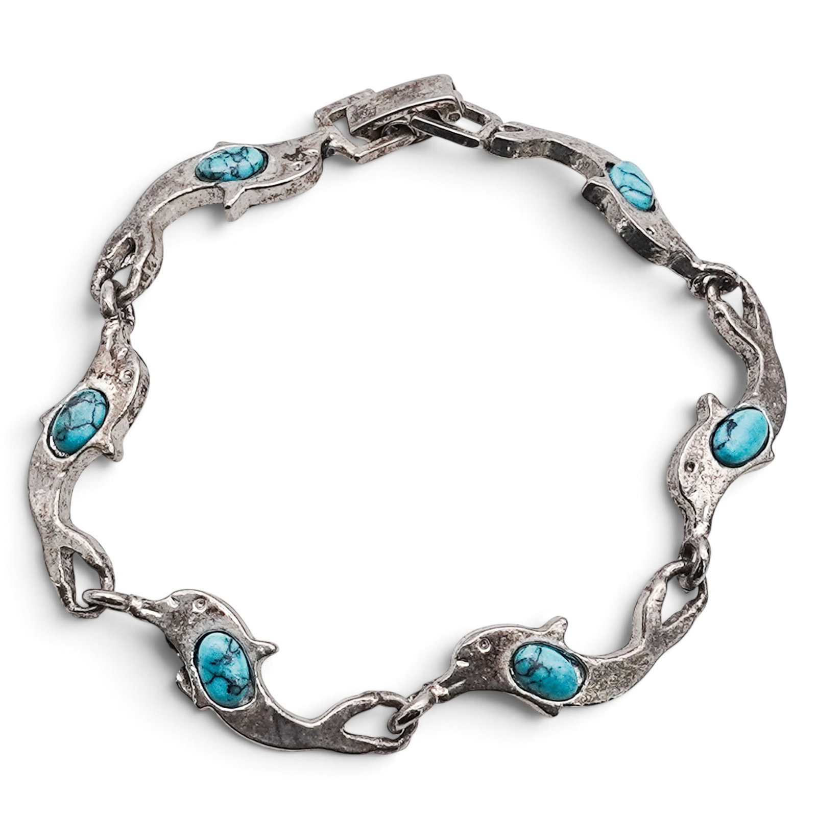 A Navajo Sterling Silver And Turquoise Dolphin Link Bracelet: A Navajo sterling silver and turquoise dolphin link bracelet Late 20th century Stamped: Unidentified crescent hallmark / 925. An articulated bracelet composed of stylized dolphin-form links, each set 