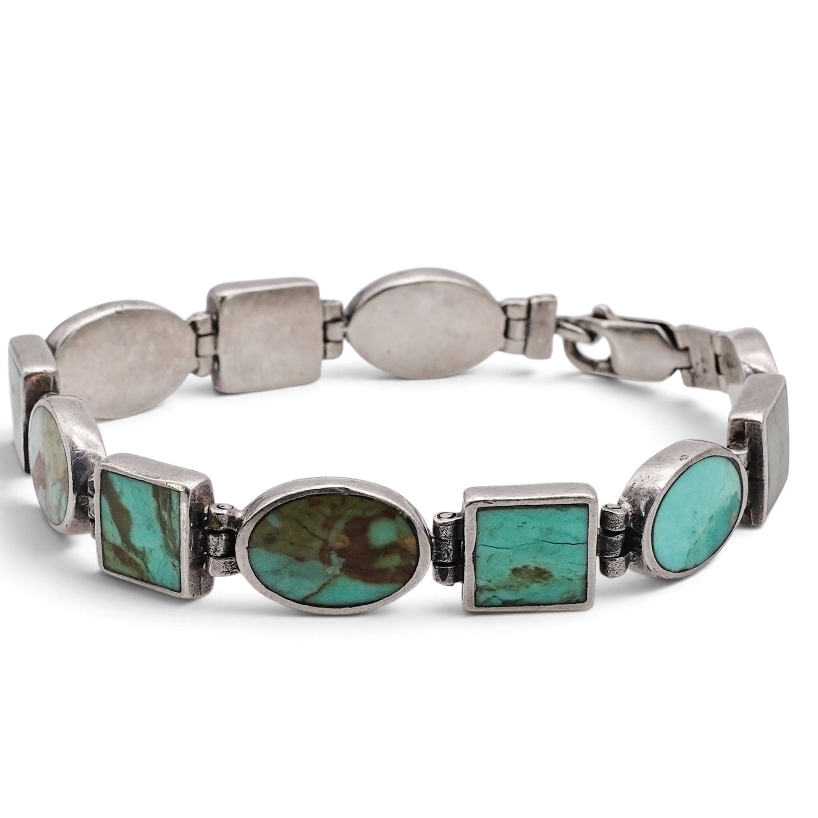 A Navajo Sterling Silver And Turquoise Link Bracelet (1 of 5)