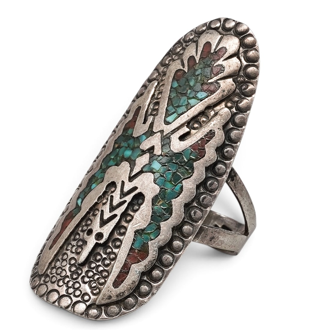 A Charlie Singer Navajo Sterling Silver, Turquoise, And Coral Chip Inlay Ring: A Charlie Singer Navajo sterling silver, turquoise, and coral chip inlay ring Late 20th Century Stamped: Charlie Singer pictorial hallmark. Tested sterling silver. A long tapered ring with turquoise a
