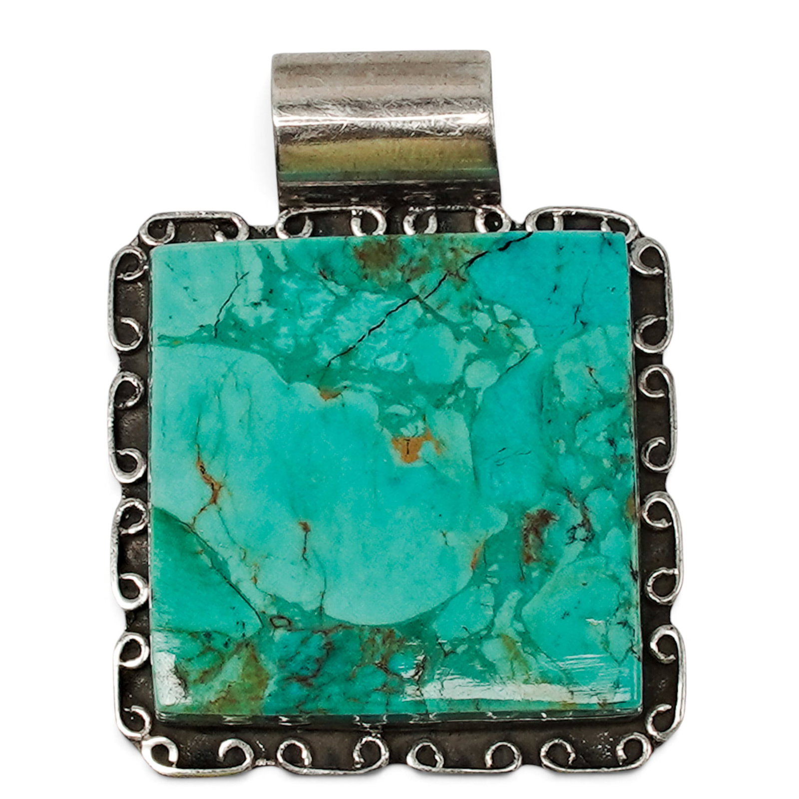 A Desert Rose Trading Navajo Sterling Silver And Turquoise Slab Pendant: A Desert Rose Trading Navajo sterling silver and turquoise slab pendant Late 20th Century Stamped: Desert Rose Trading / .925. A substantial pendant set with a large freeform turquoise slab in a bezel