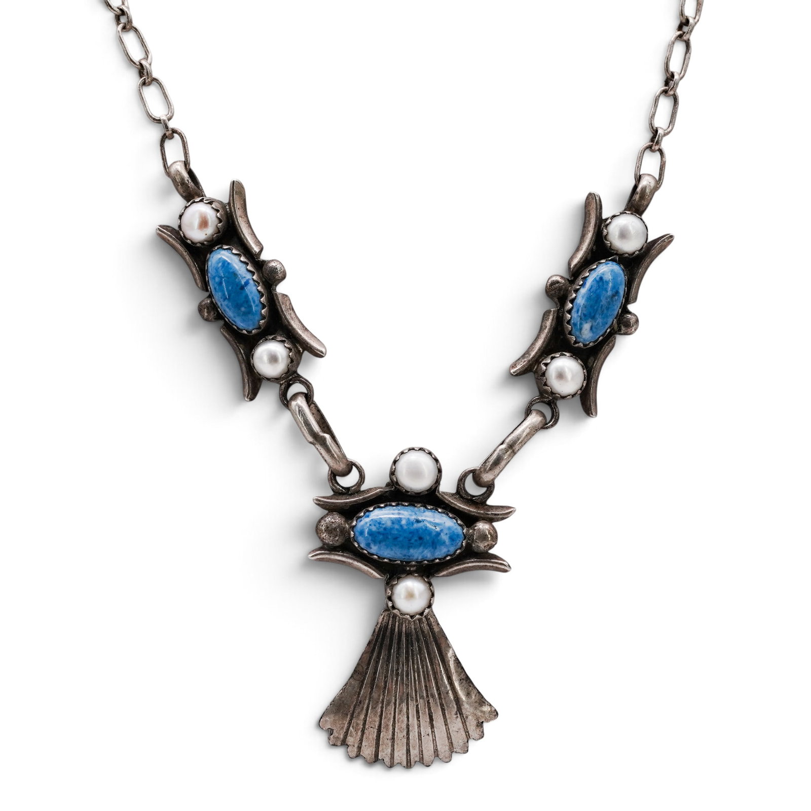A Nelson Garcia Kewa Sterling Silver And Turquoise Feather Pendant Necklace: A Nelson Garcia Kewa sterling silver and turquoise feather pendant necklace Late 20th Century Stamped: N.G. / 925 / illegible hallmark. A pendant necklace with a feather-form top above three articulat