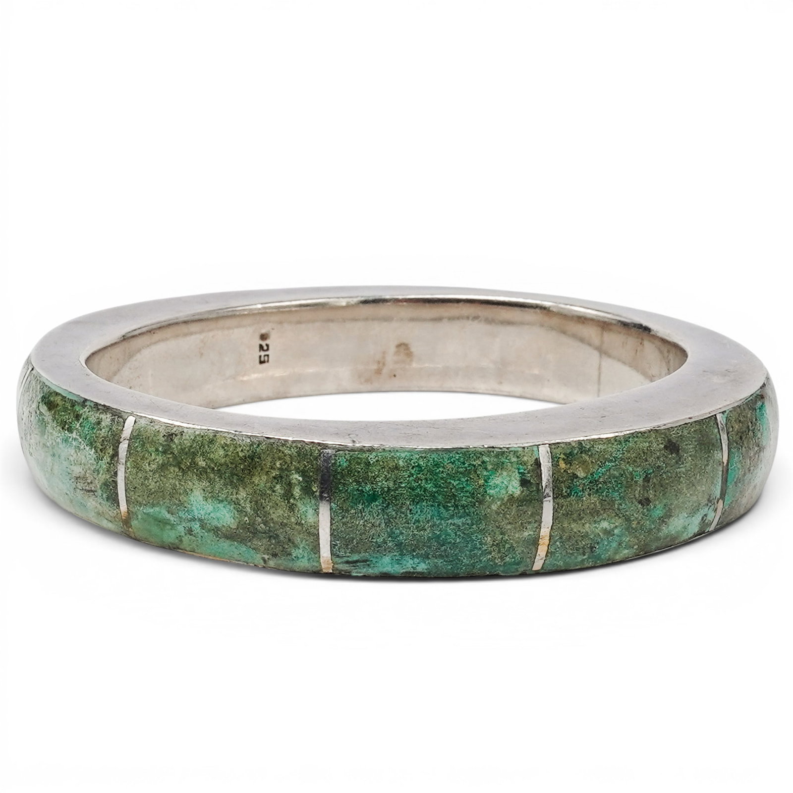 A Navajo Silver And Turquoise Channel Inlay Cuff Bracelet: A Navajo silver and turquoise channel inlay cuff bracelet Late 20th Century Stamped: 925. A wide cuff bracelet with channel inlaid turquoise segments in a continuous geometric pattern across the top h
