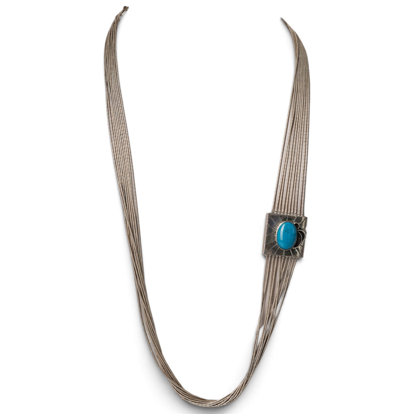 A Navajo Sterling Silver And Turquoise Liquid Silver Slide Necklace: A Navajo sterling silver and turquoise liquid silver slide necklace Late 20th century Stamped: Sterling. A multi-strand liquid silver necklace centered by a rectangular slide set with a bezel-set turq