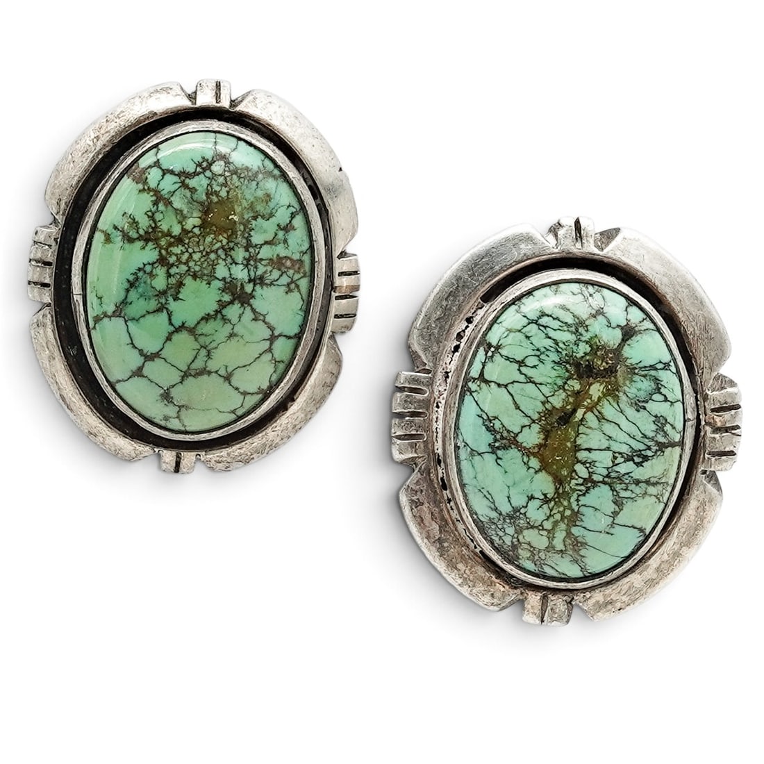 A Pair Of First American Traders Gallup Sterling Silver And Turquoise Oval Post Earrings: A pair of First American Traders Gallup sterling silver and turquoise oval post earrings Late 20th century Stamped: Sterling / First American Traders hallmark. Each with an oval turquoise cabochon in 