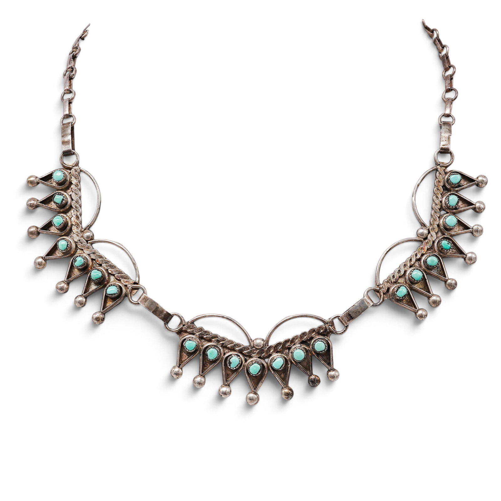 A Navajo Sterling Silver And Turquoise Fan Panel Necklace: A Navajo sterling silver and turquoise fan panel necklace Late 20th century Stamped: Y.J., unidentified signature. Tested sterling silver. A necklace centered by three articulated fan-form panels set 