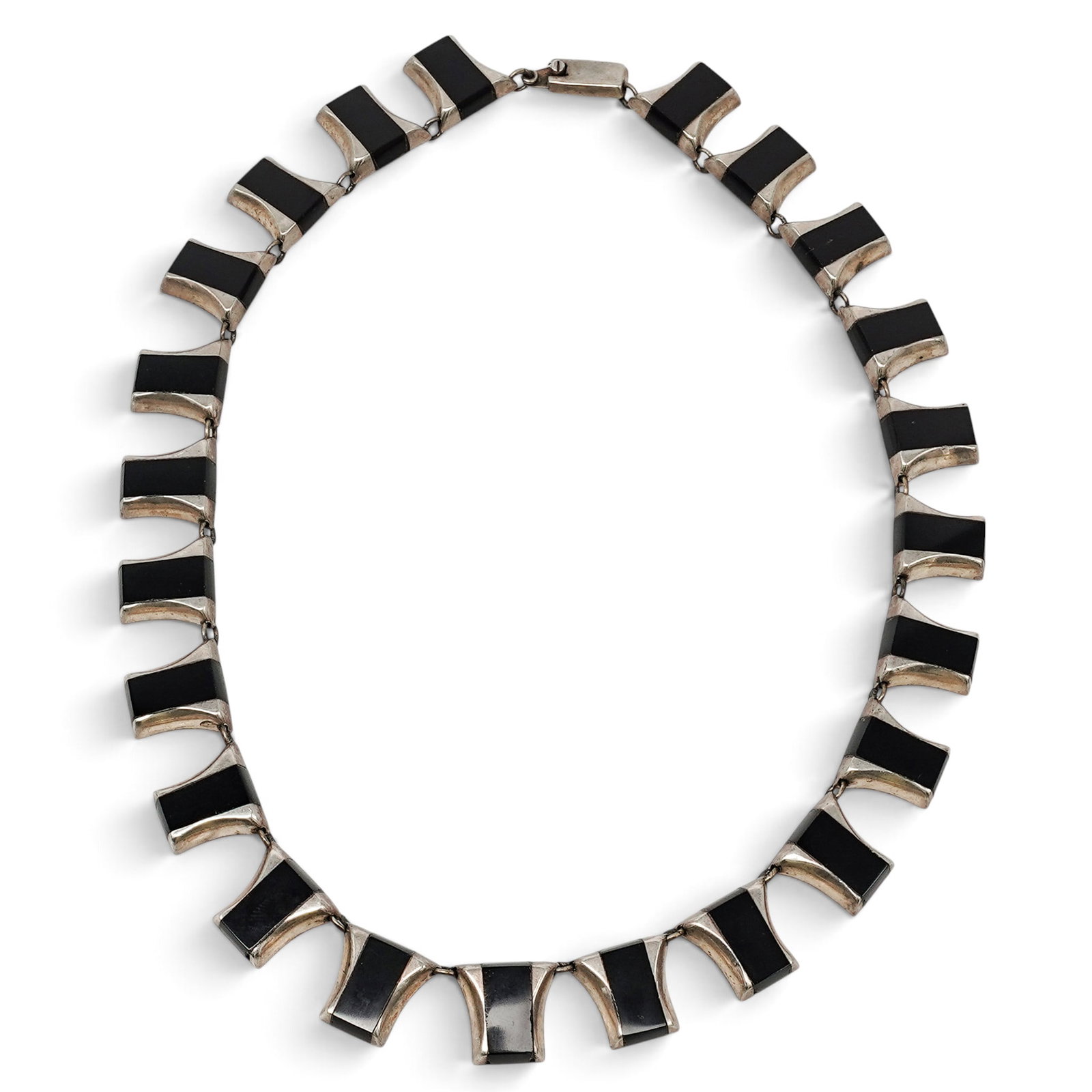 A Mexican Sterling Silver And Black Onyx Link Necklace: A Mexican sterling silver and black onyx link necklace Late 20th century Stamped: Mexico / 925 / illegible mark. A necklace composed of articulated geometric silver links, each set with a rectangular 