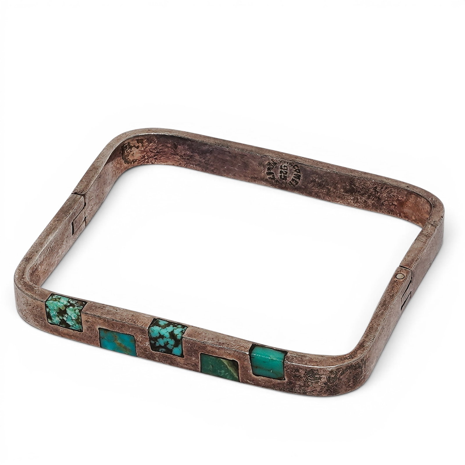 A Taxco Mexican Sterling Silver And Turquoise Inlay Rectangular Cuff Bracelet: A Taxco Mexican sterling silver and turquoise inlay rectangular cuff bracelet Late 20th century Stamped: Taxco Mexico / .925 / TL-170 A rectangular-form silver cuff bracelet with alternating turquoise