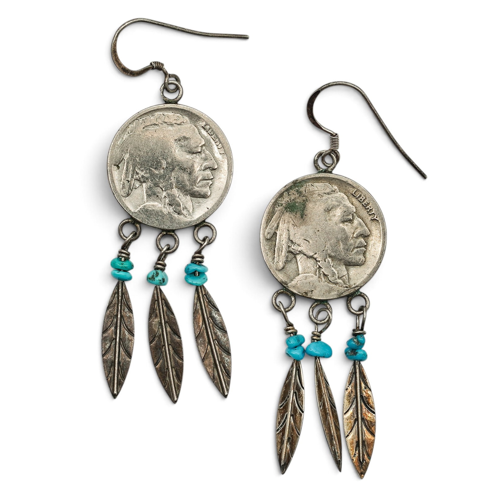 A Pair Of Navajo Sterling Silver, Turquoise, And Buffalo Nickel Feather Dangle Earrings: A pair of Navajo sterling silver, turquoise, and Buffalo nickel feather dangle earrings Late 20th Century Unmarked. Tested sterling silver. Each suspending a five cent Buffalo nickel above turquoise