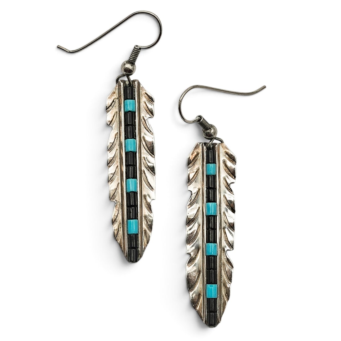 A Pair Of Navajo Sterling Silver, Turquoise, And Onyx Feather Earrings: A pair of Navajo sterling silver, turquoise, and onyx feather earrings Late 20th century Stamped: Sterling Each feather-form earring has a central channel inlay of turquoise and onyx tabs, with