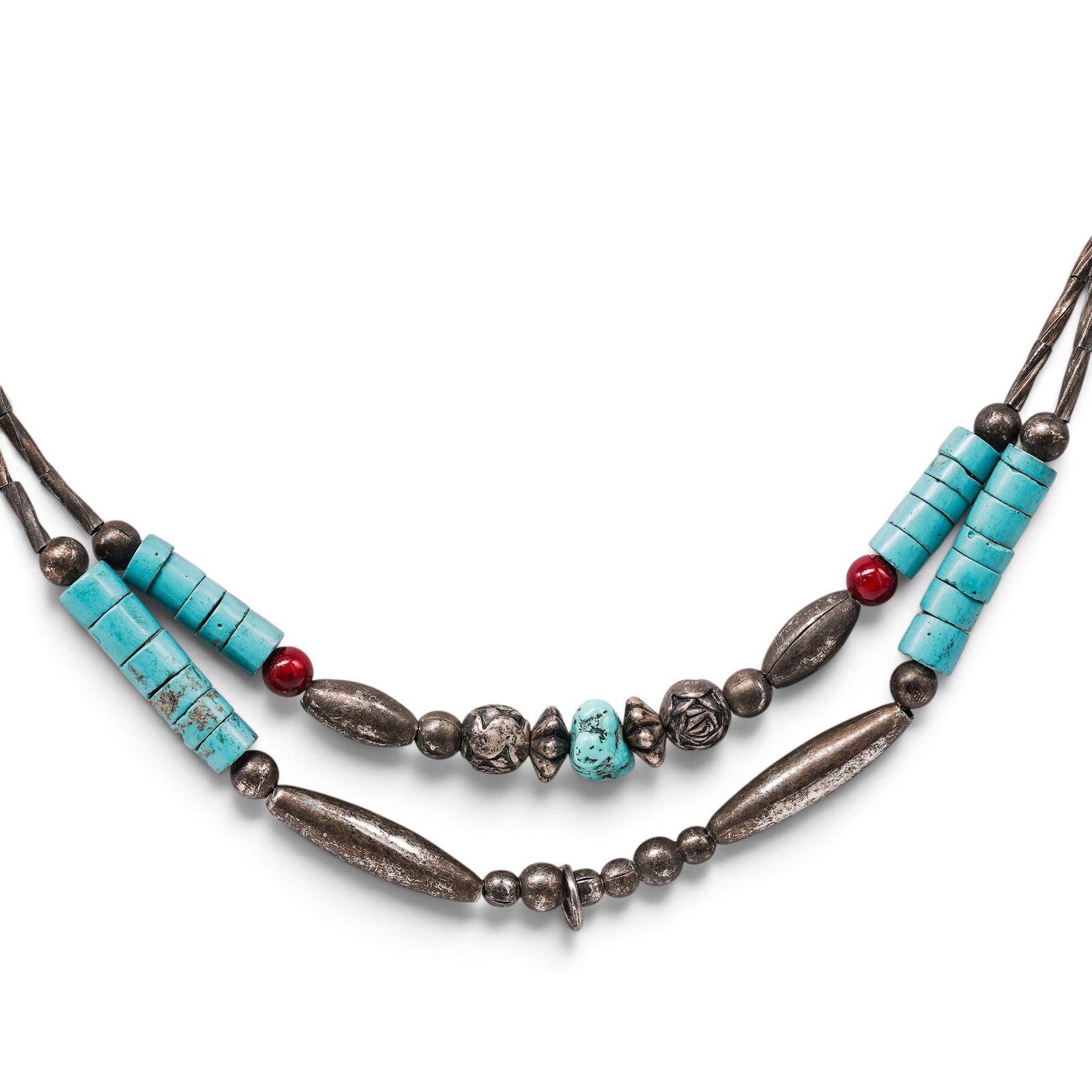 A Navajo Sterling Silver, Turquoise, And Coral Bead Necklace: A Navajo sterling silver, turquoise, and coral bead necklace Late 20th century Unmarked. Tested sterling silver. A necklace composed of turquoise tube beads, turquoise nugget beads, coral accent beads