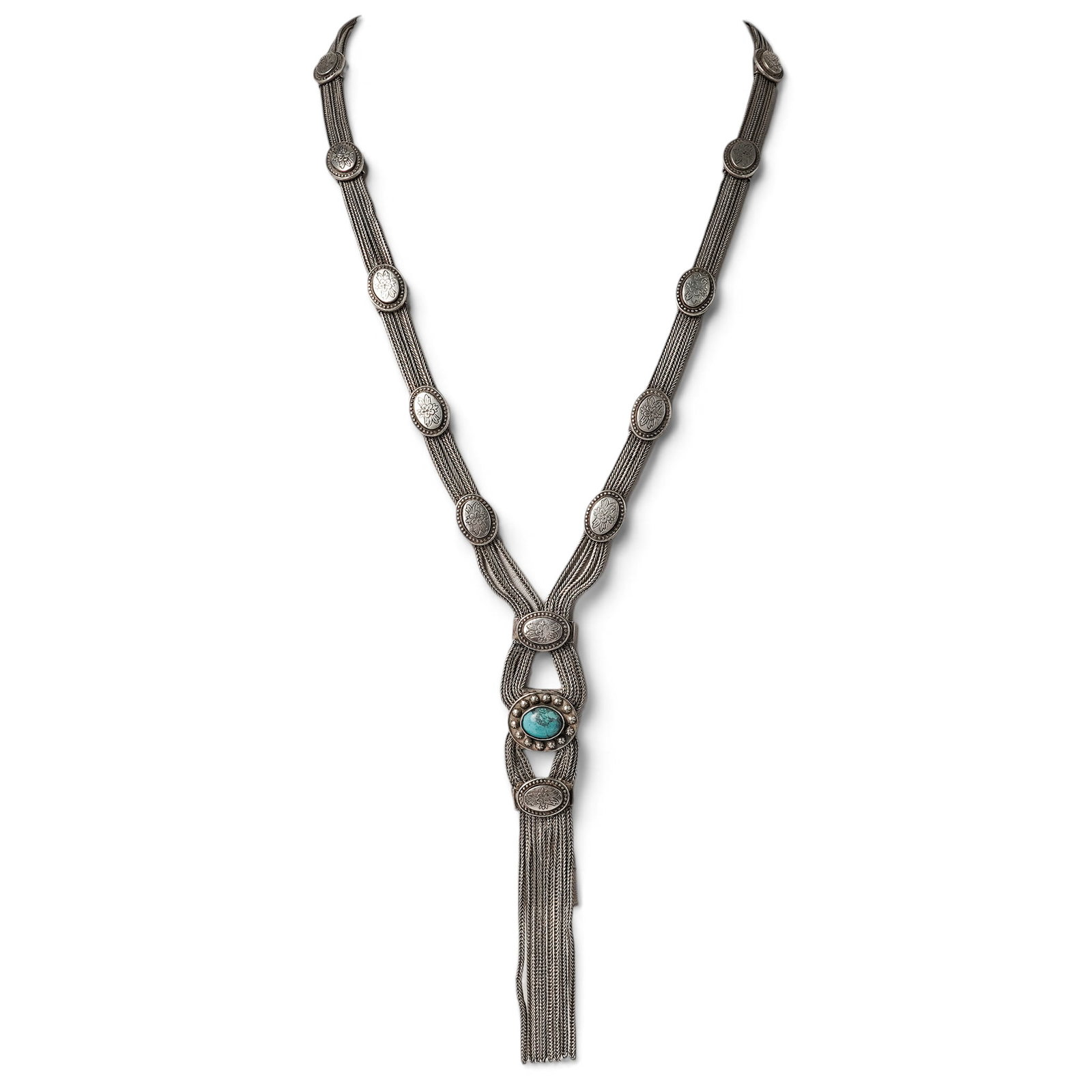 A Navajo Silver And Turquoise Liquid Silver Station Necklace: A Navajo silver and turquoise liquid silver station necklace Late 20th century Stamped: 900. A multi-strand liquid silver necklace with oval silver stations and a central turquoise-set element accente