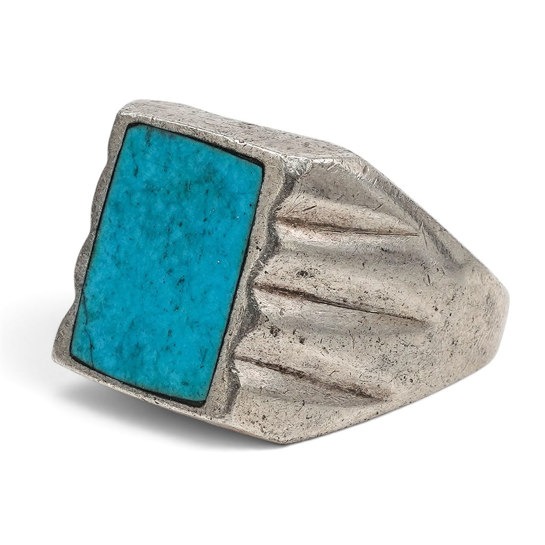 A Mexican Sterling Silver And Rectangular Turquoise Ring: A Mexican sterling silver and rectangular turquoise ring Late 20th century Stamped: Mexico / TG-815. Tested sterling silver. A substantial signet-style ring set with a rectangular turquoise inlay plaq