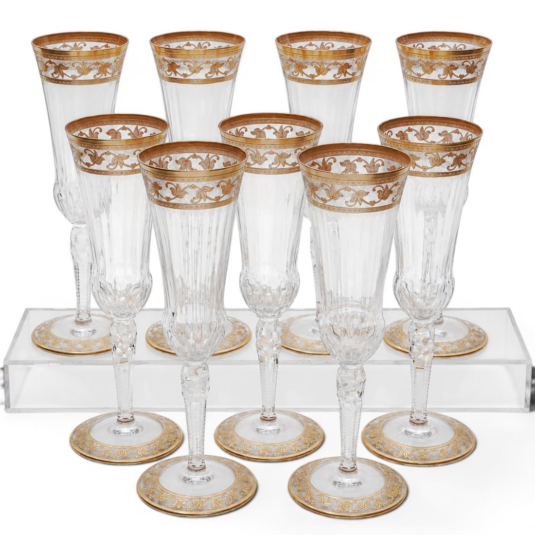 (9pc) St.Louis "Thistle Gold" Crystal Champagne Flutes: (9pc) St.Louis "Thistle Gold" Crystal Champagne Flutes 20th Cent.,French Set of nine crystal champagne flutes by Cristallerie Saint-Louis in the Thistle Gold pattern. Each features a mouth-blown and h