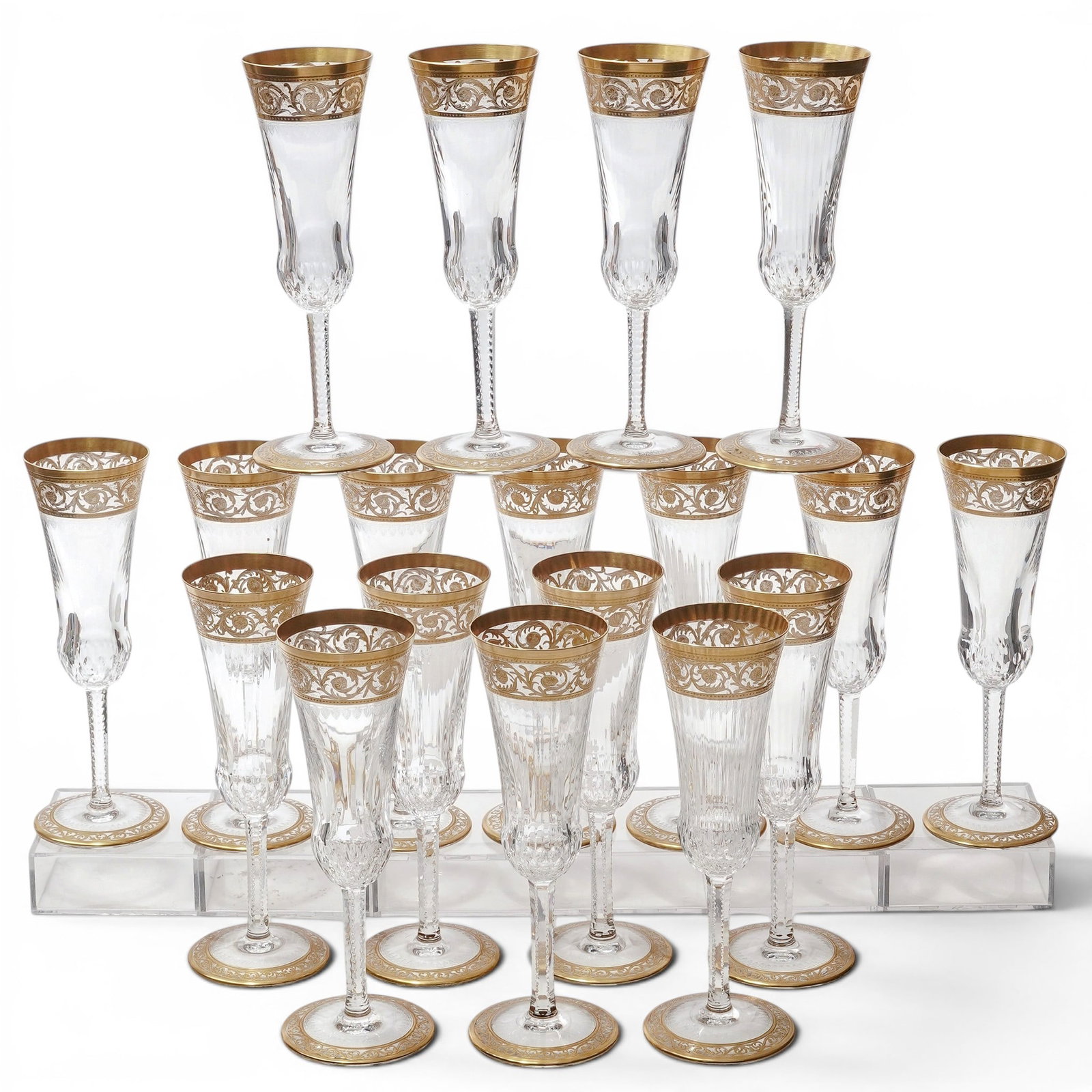 (18pc) St. Louis "Thistle Gold" Crystal Champagne Flutes: (18pc) St. Louis "Thistle Gold" Crystal Champagne Flutes 20th Cent., French Set of eighteen crystal champagne flutes by Cristallerie Saint-Louis in the Thistle Gold pattern. Each features a mouth-blow