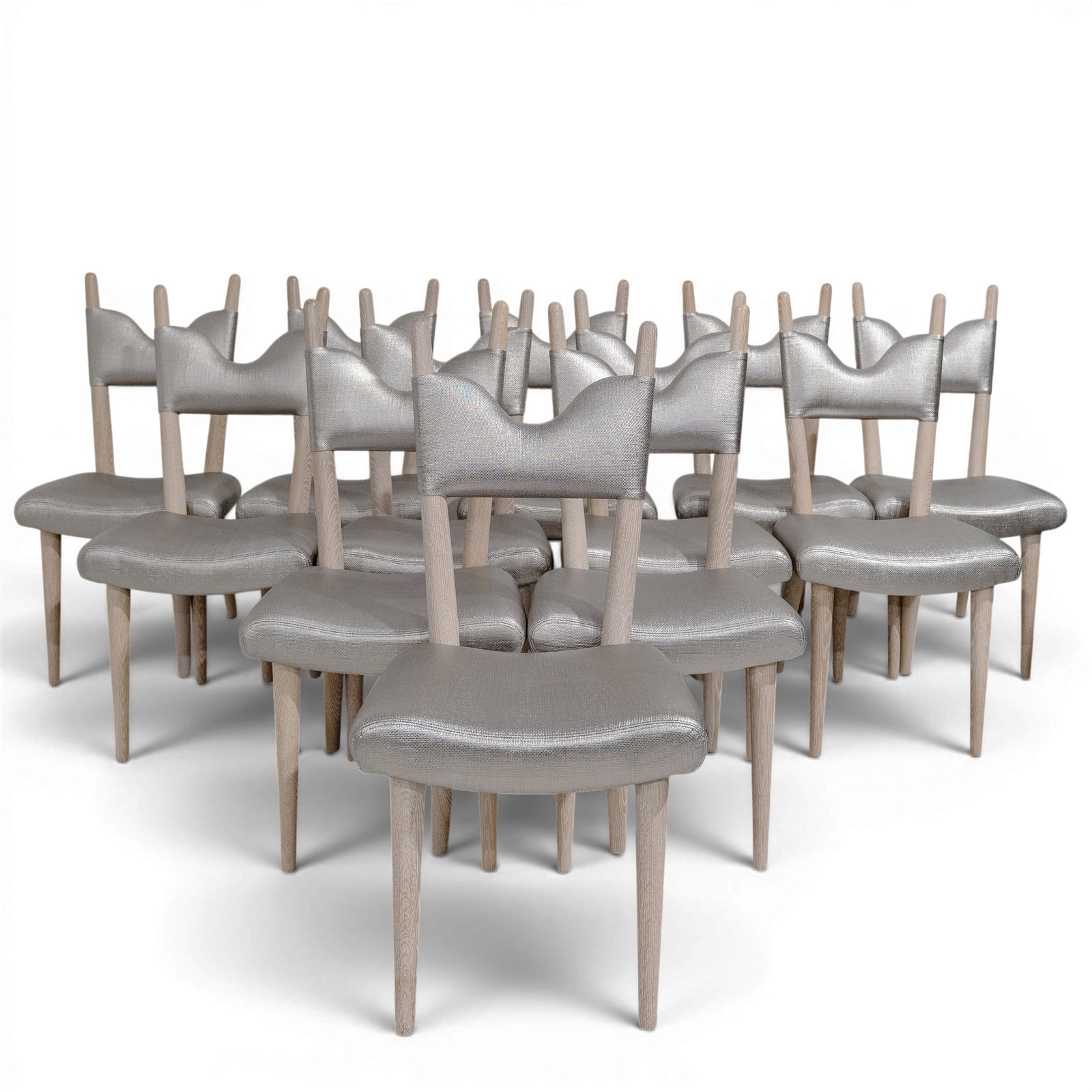 (12 pc) Jean Royere Dining Chairs: (12 pc) Jean Royere Dining Chairs Mid-20th Century, France Set of twelve Jean Royère dining chairs featuring the designer's iconic whimsical silhouette with sculptural crest rails and gently curved