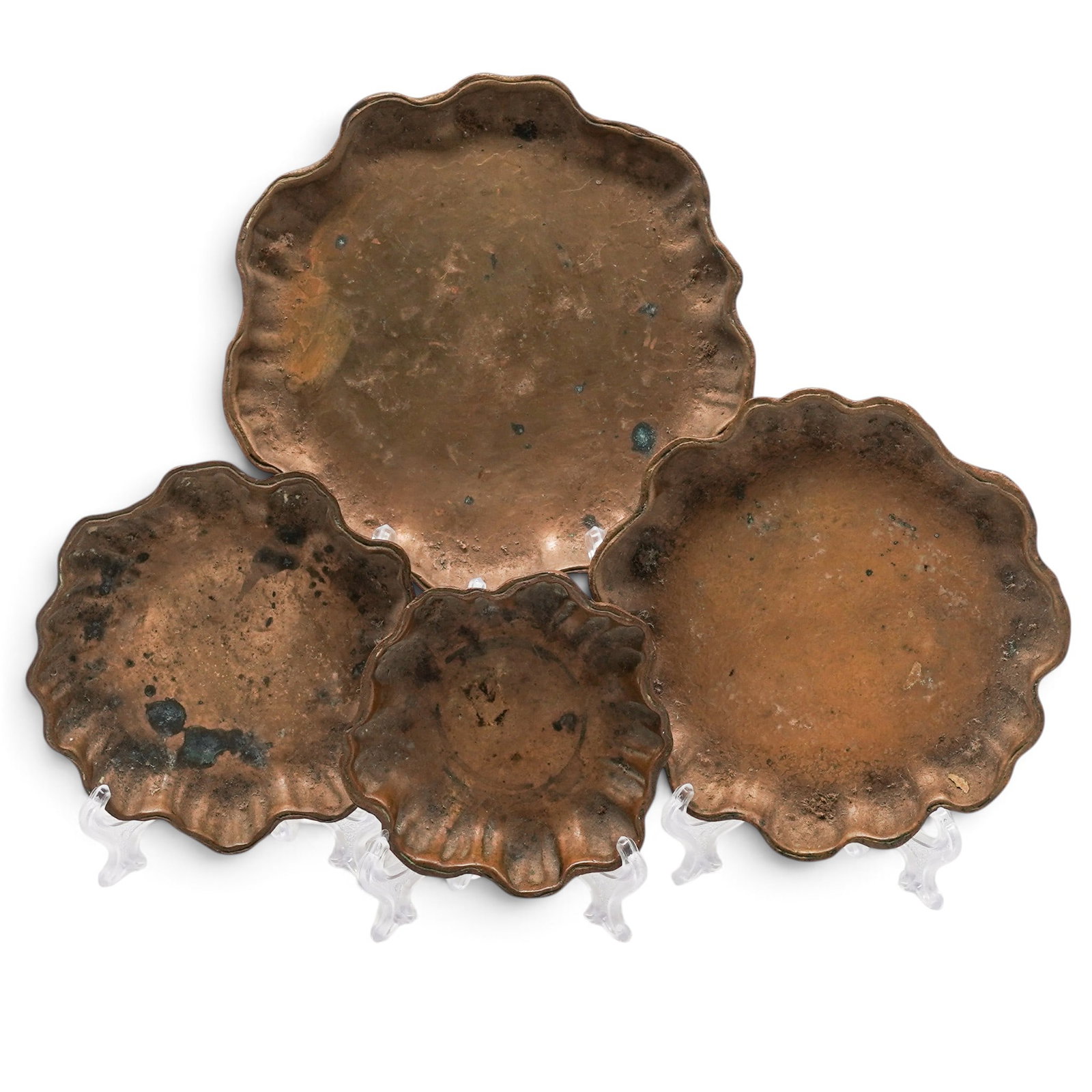 (4 pc) Tiffany Studios Bronze Graduated Nut Bowls: (4 pc) Tiffany Studios Bronze Graduated Nut Bowls circa 1910, American A four piece scalloped edge bronze vide poche graduated dish set by Tiffany Studios, model 1719. Each marked on bottom "Tiffany