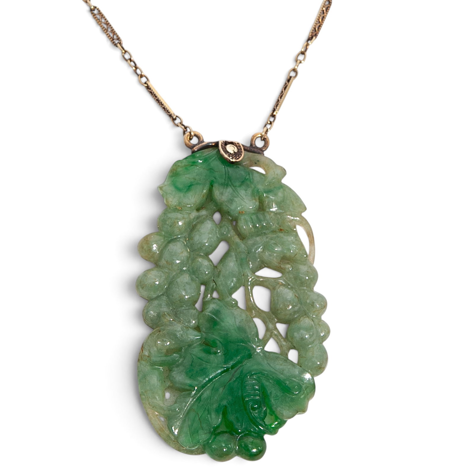 Chinese Art Deco Jadeite and 14k Gold Necklace: Chinese Art Deco Jadeite and 14k Gold Necklace Early 20th century, Chinese Chinese Art Deco jadeite and 14k gold necklace. Jadeite pendant is carved with grapevines and squirrels and pierced openwork 
