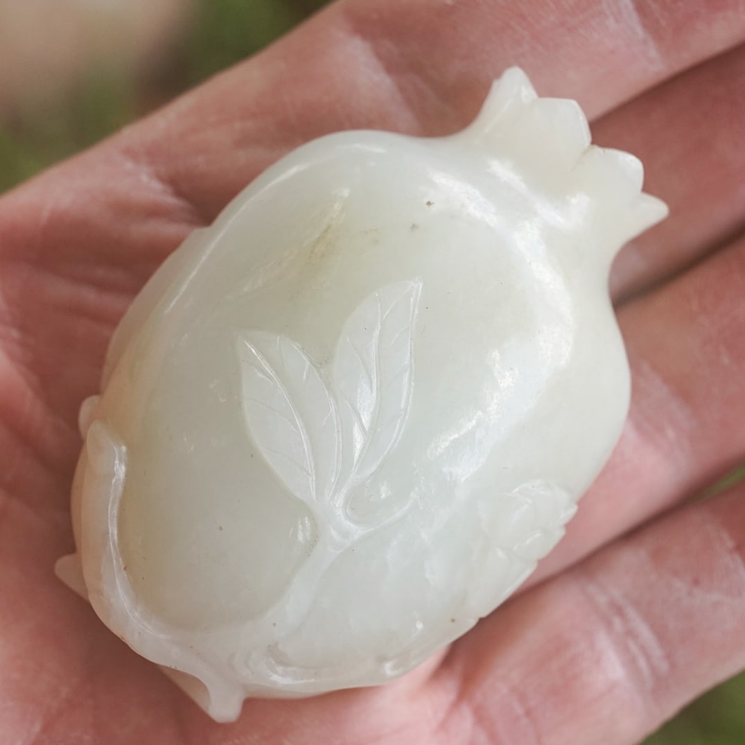 Chinese White Jade Fruit Snuff Bottle: Chinese White Jade Fruit Snuff Bottle 19th century (Qing dynasty), Chinese A jade snuff bottle in the shape of a fruit with the stopper being the bud of the fruit. Fruit is carved in relief, with