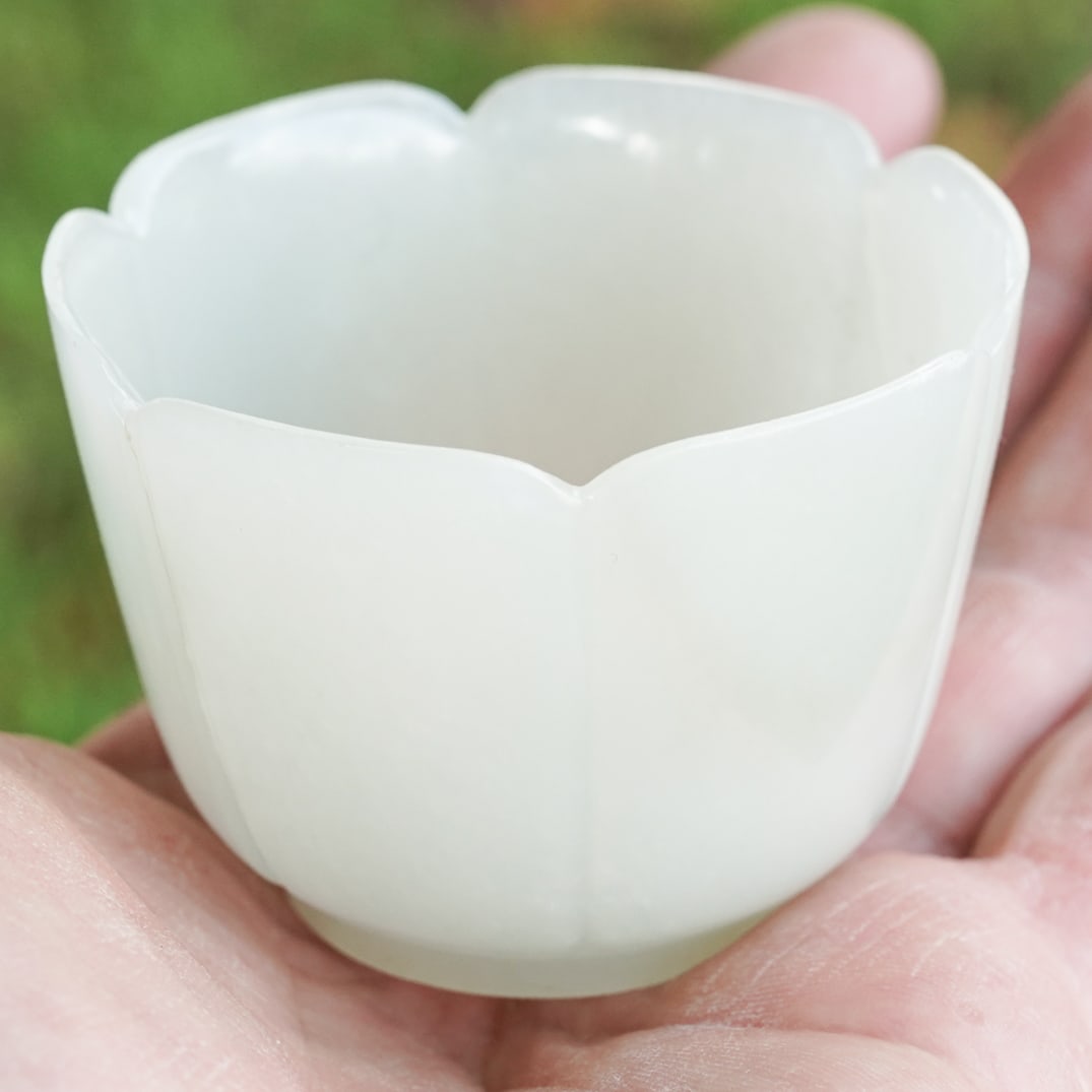 Chinese White Jade Wine Cup: Chinese White Jade Wine Cup Late 18th century- 19th century, Chinese Chinese white jade tulip shaped wine cup. Six defined carved petals from the foot rising to the mouth. Foot raised. H 2.75" x