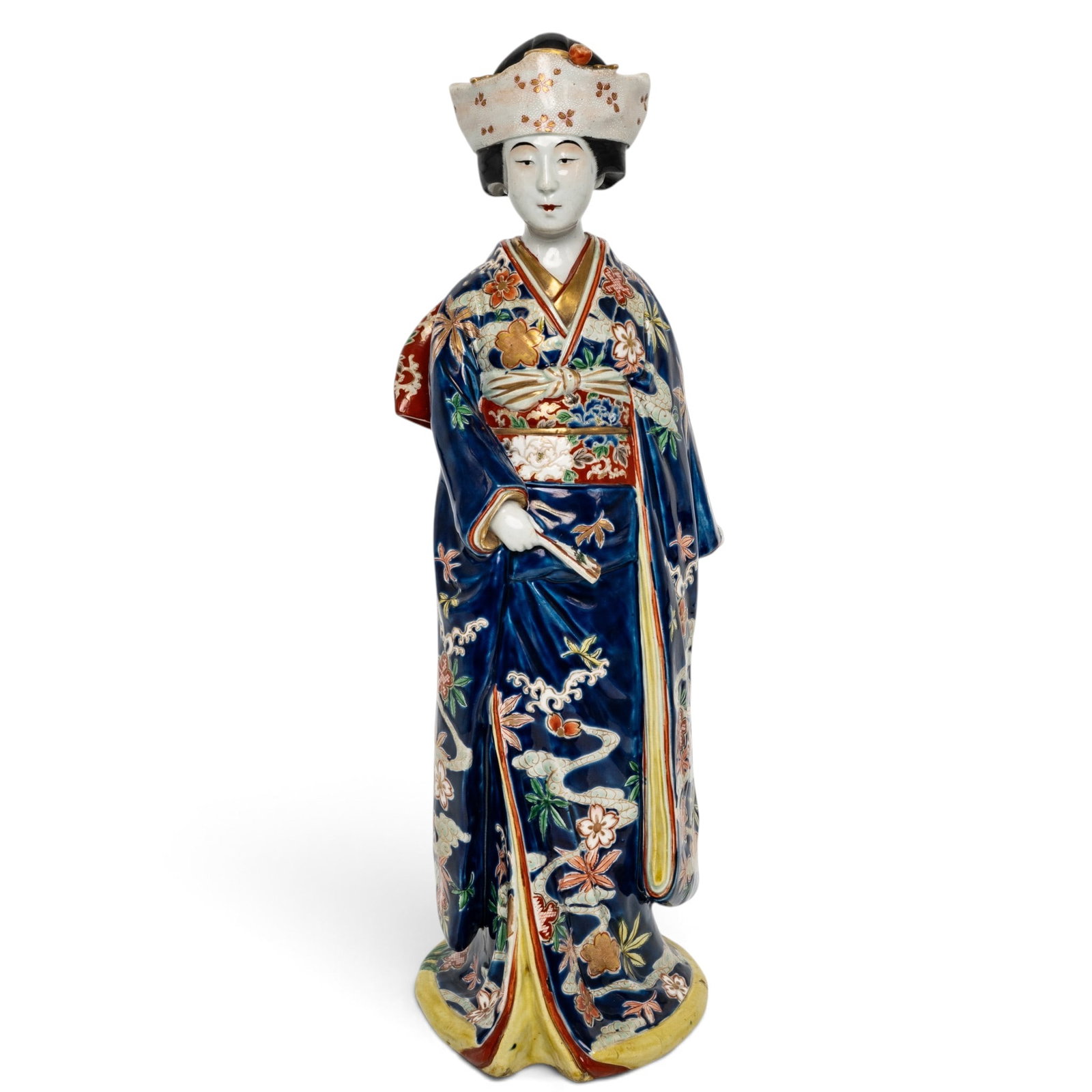 Large Japanese Kutani Porcelain Geisha: Large Japanese Kutani Porcelain Geisha Late Meiji- Taisho period, Japanese Large and impressive porcelain wearing elaborate Japanese robe featuring a cobalt blue field, figure is holding a fan in one 