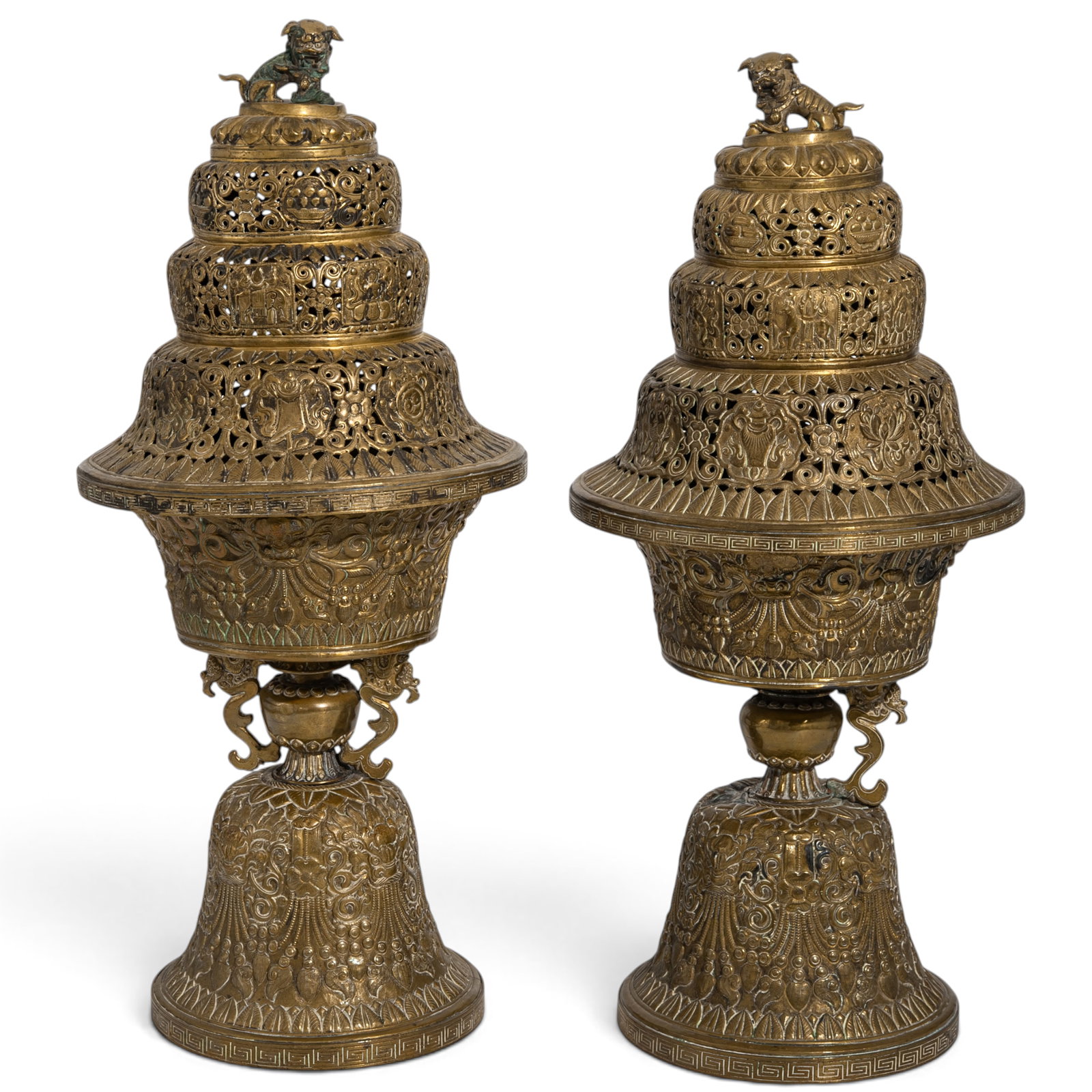 Pair of Tibetan Altar Butter Lamps: Pair of Tibetan Altar Butter Lamps 19th Century, Southeast Asia This matched pair of covered butter lamps with raised emblems and open-work pierced floral design. Buddhist lion finial to tops. Cup wit