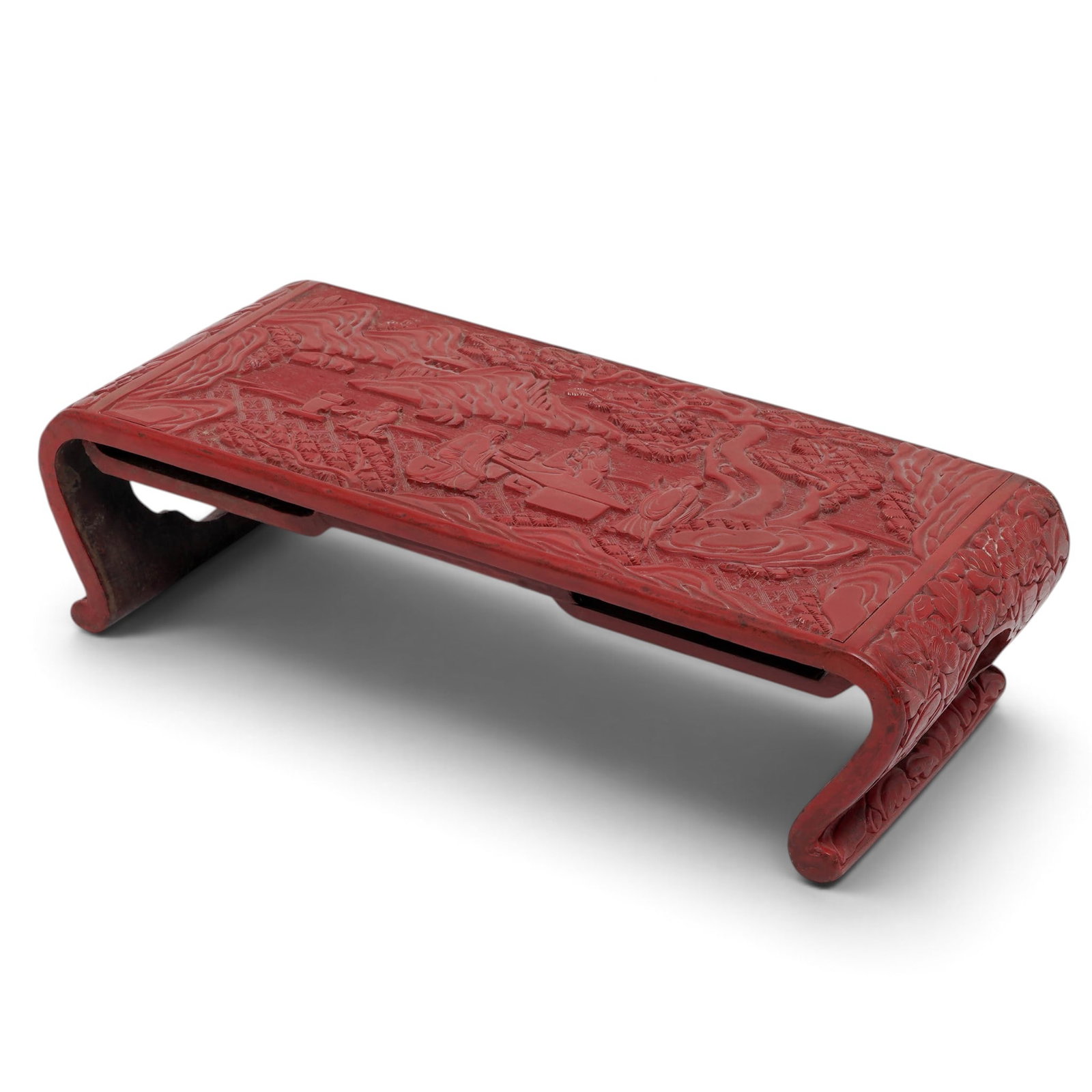 Chinese Cinnabar Lacquer Scholars Table: Chinese Cinnabar Lacquer Scholars Table Late 17th to Early 18th Century, China This finely carved lacquer table with scene of scholars studying amongst mountains and pine trees. The sides carved with 