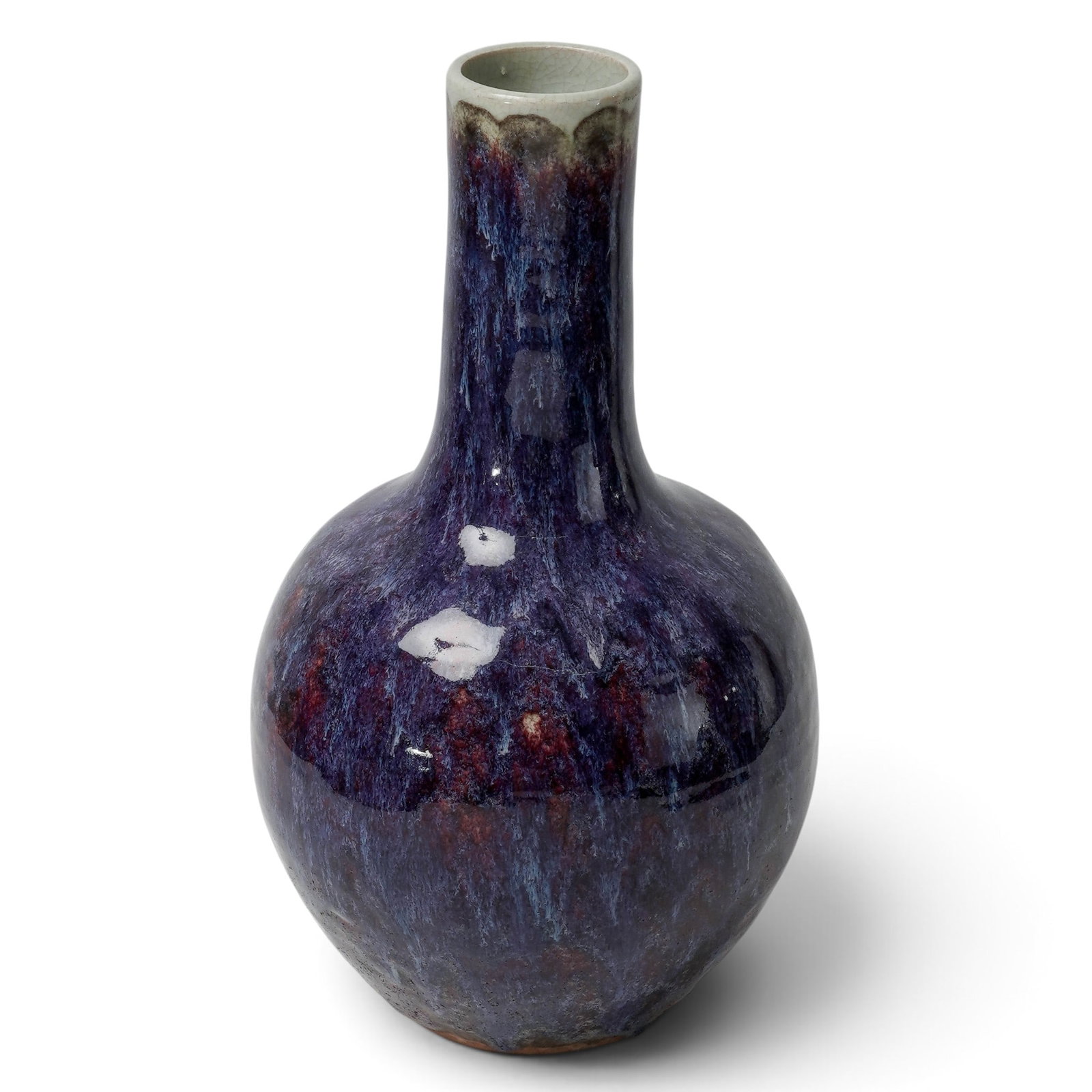 Chinese Porcelain Bottle Shaped Flambe Vase: Chinese Porcelain Bottle Shaped Flambe Vase Late 18th to Early 19th Century, China The neck of this vase starts with a white crackle and turns into a red purple and blue glaze which flows downward to 