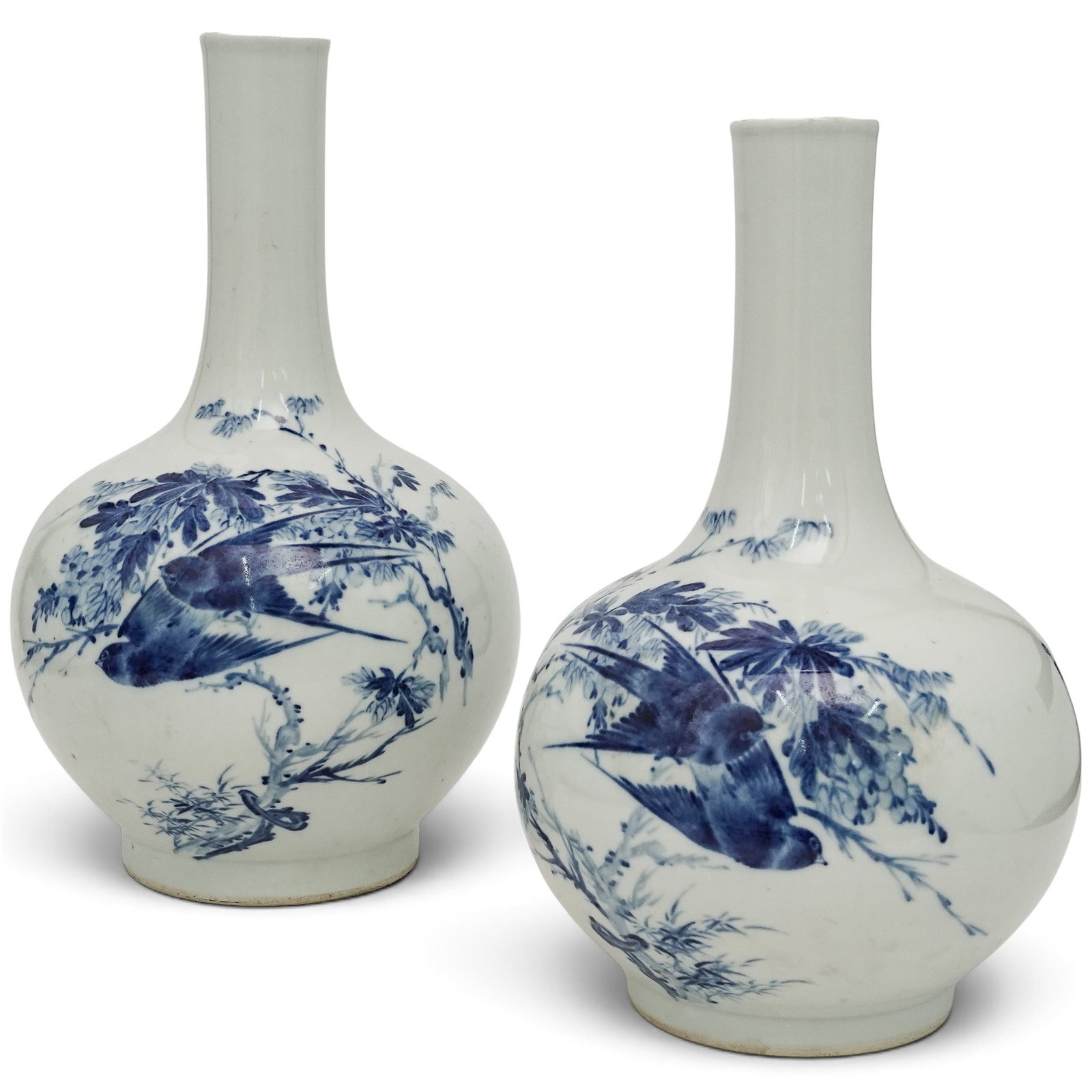 Pair of Chinese Blue & White Porcelain Bottle Vases: Pair of Chinese Blue & White Porcelain Bottle Vases 20th century, Chinese Pair of Chinese blue & white porcelain bottle shaped vases. This matched pair (right and left) with birds flying through flowe