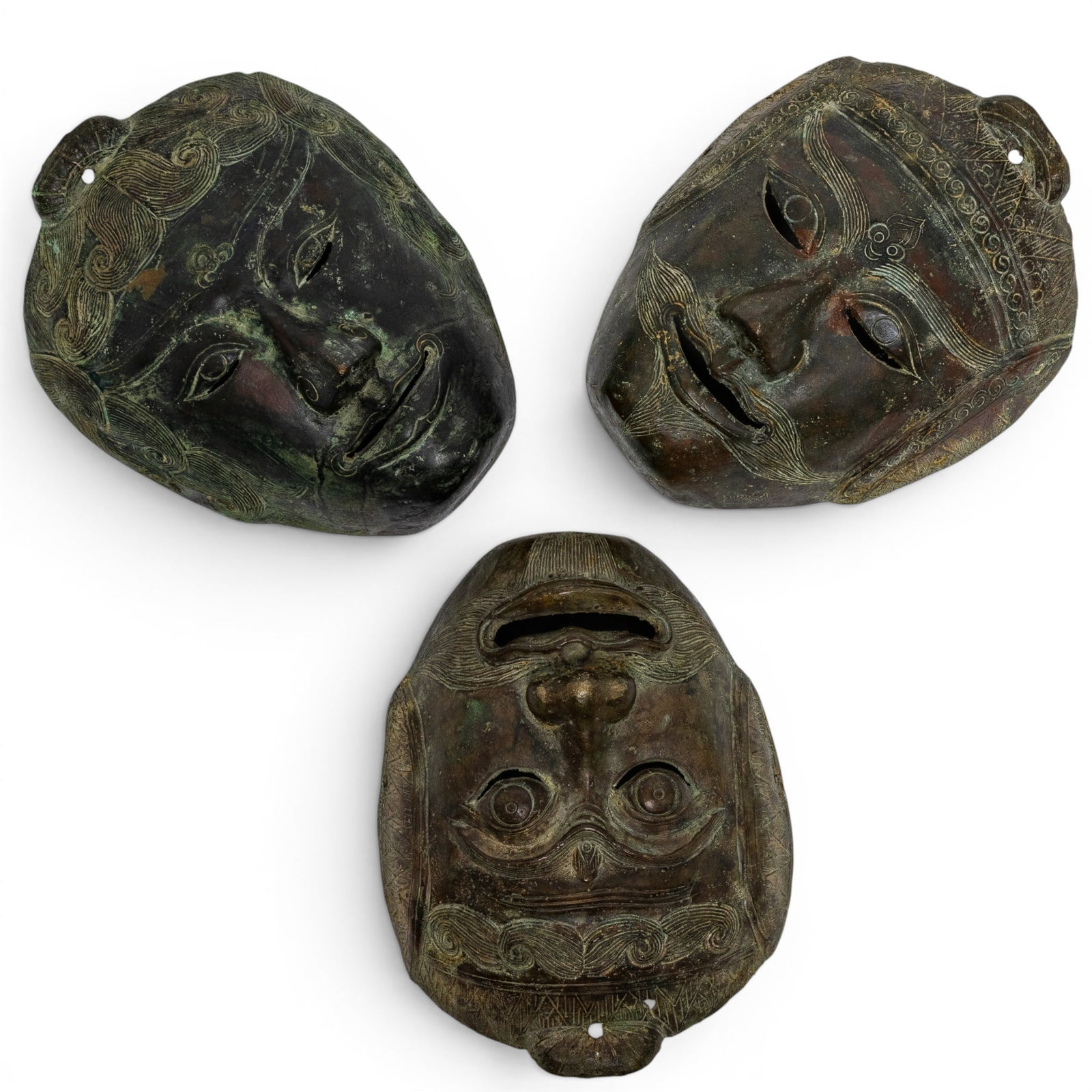 (3 pcs) Set of Javanese Bronze Masks: (3 pcs) Set of Javanese Bronze Masks Mid 20th century, Javanese These cast Javanese bronze masks each having detail to hair, eyes, and mouth. Patina ranges from light to dark brown with areas of