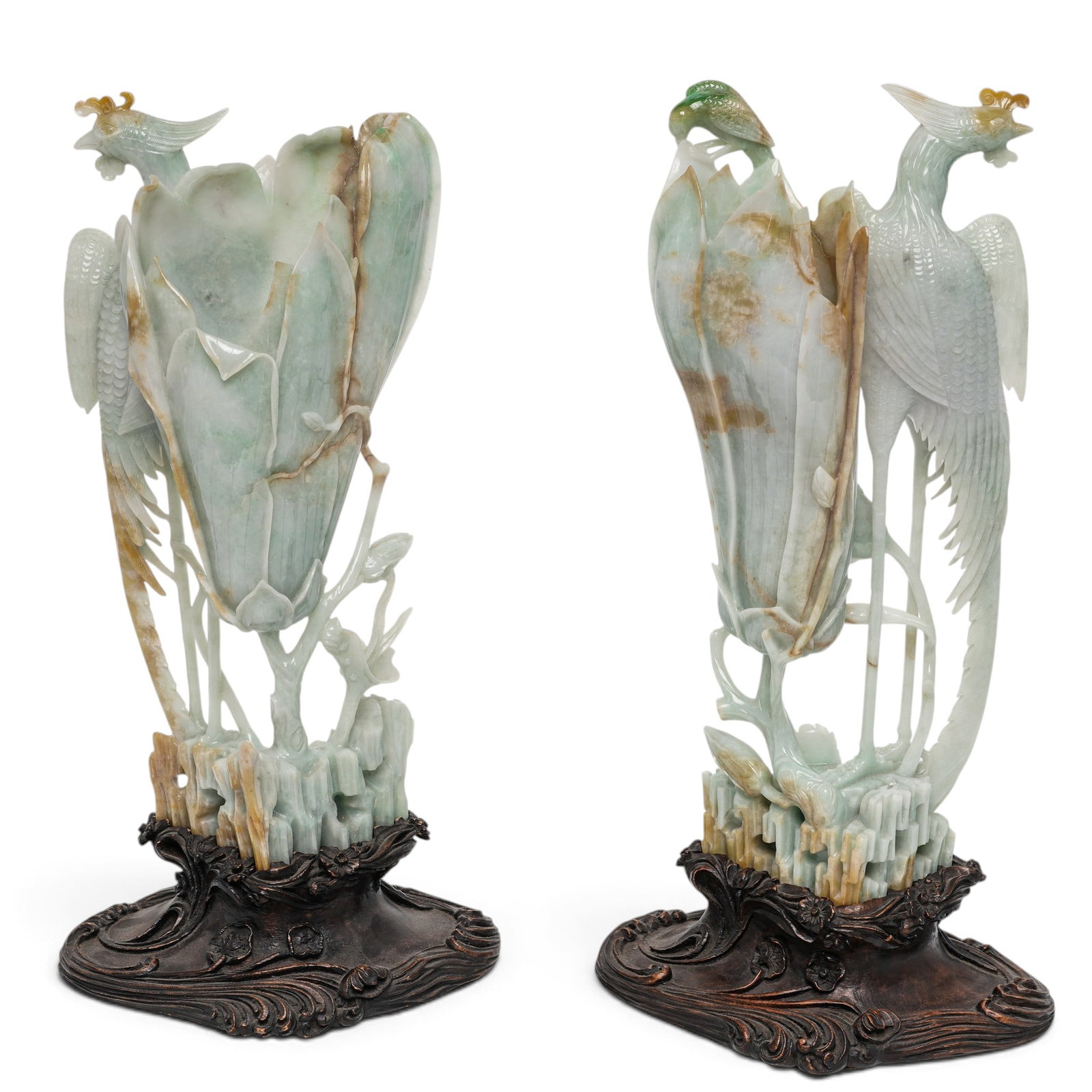 Masterpiece Chinese Jadeite Carved Phoenix & Magnolia Bloom Vases: Masterpiece Chinese Jadeite Carved Phoenix & Magnolia Bloom Vases Late Qing- early 20th century, Chinese This large size pair of carvings with standing phoenix (14.75" from comb of bird to bottom of t