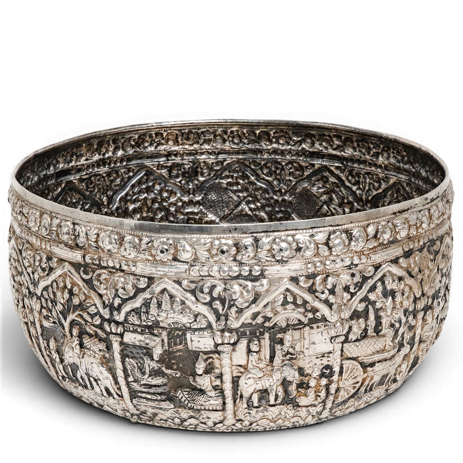 Large Burmese Pure Silver (94%) Bowl on Three Feet: Large Burmese Pure Silver (94%) Bowl on Three Feet Late 19th-early 20th century, Burmese This is a large and impressive Burmese pure silver bowl with multiple scenes in relief of Buddhas, shrines, ele