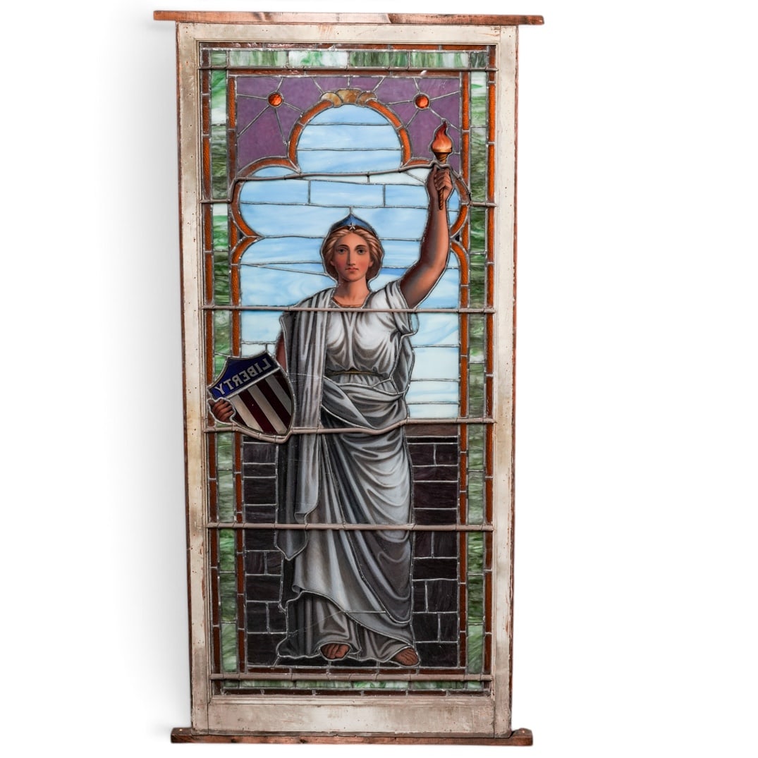 Rare American Stained Glass Window of Lady Liberty: Rare American Stained Glass Window of Lady Liberty Late 19th century, American This fantastic window of Lady Liberty holding her torch and shield was located in a bank in Kansas City around the turn o